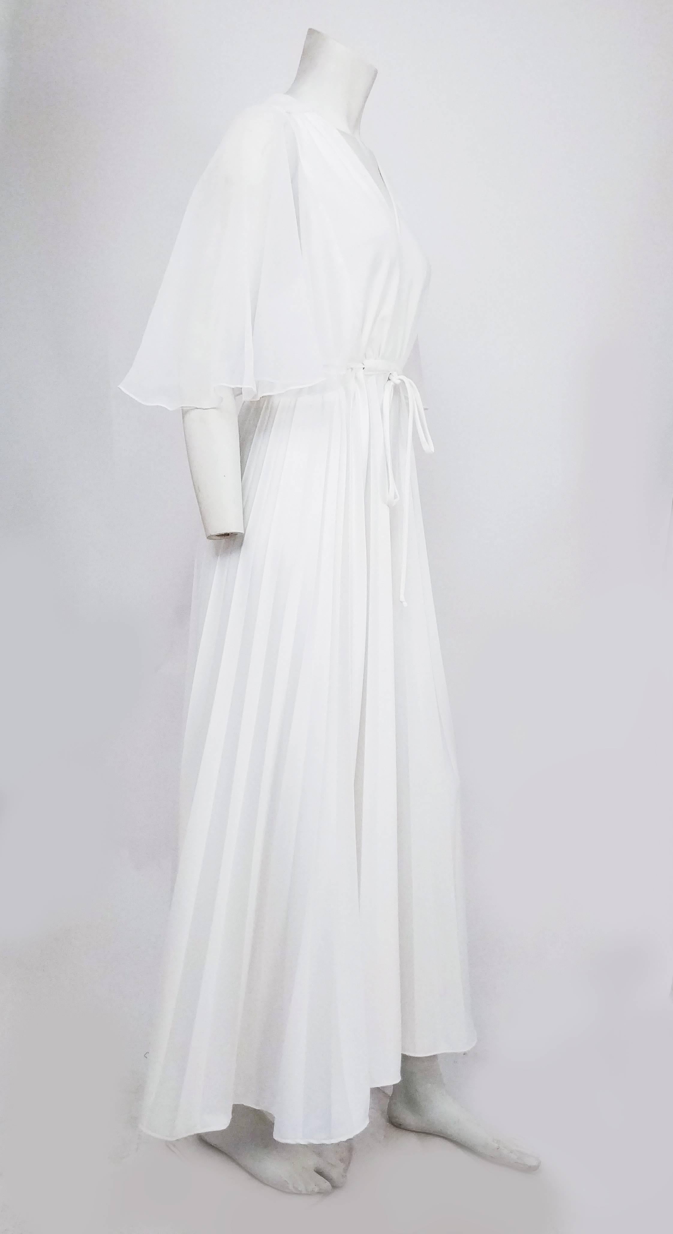 1970s White Chiffon Evening Dress. Flowing cape sleeves, adjustable waist ties at back, gathered Grecian style skirt. 