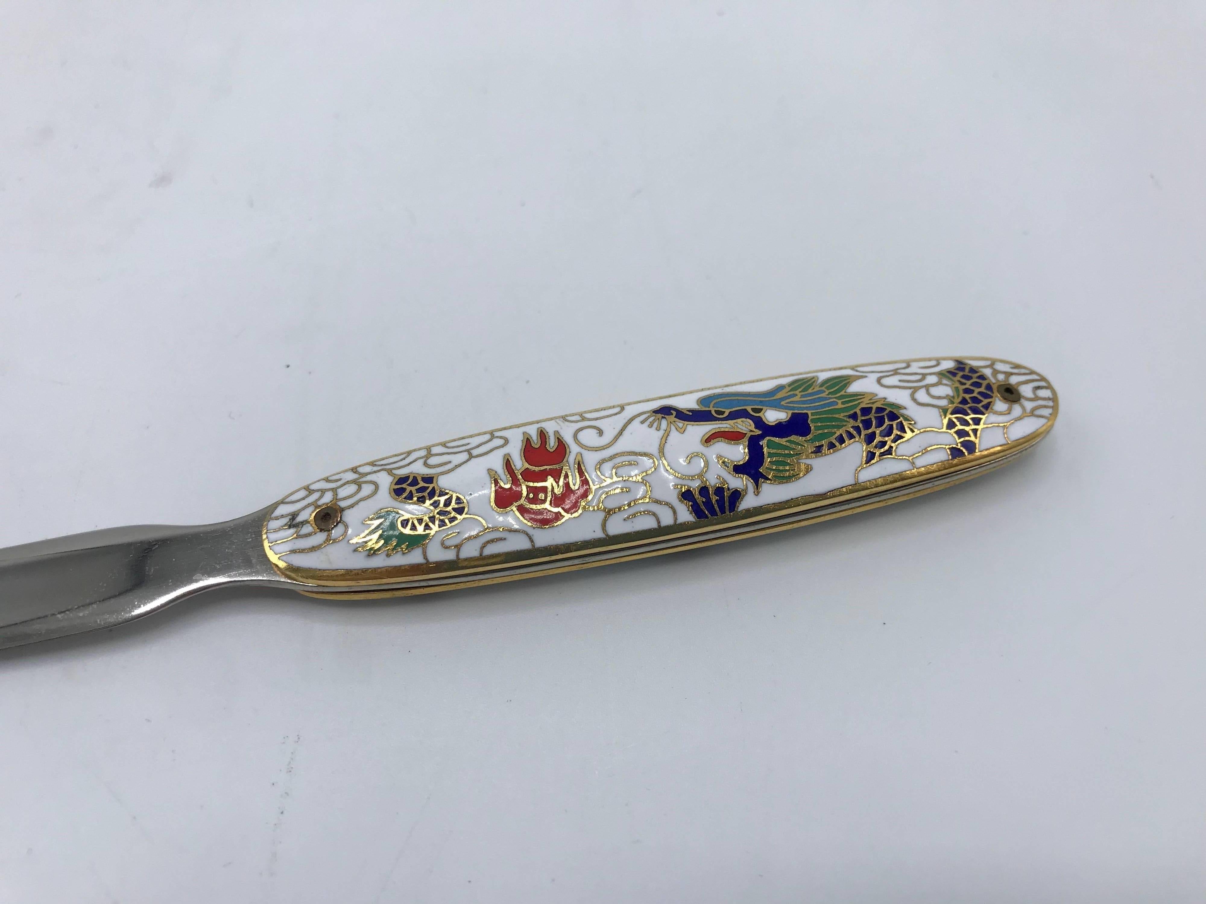 Offered is a gorgeous, never used, 1970s white cloisonné letter opener with a dragon motif. Three available.