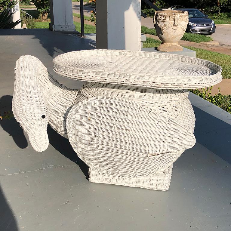 Animalia vintage 1960s-1970s Italian woven wicker swan occasional table/garden stool in excellent condition. Rigid wood frame construction with densely woven sculpted wicker. Top features a removable wicker top tray. Hand painted eyes.

This would
