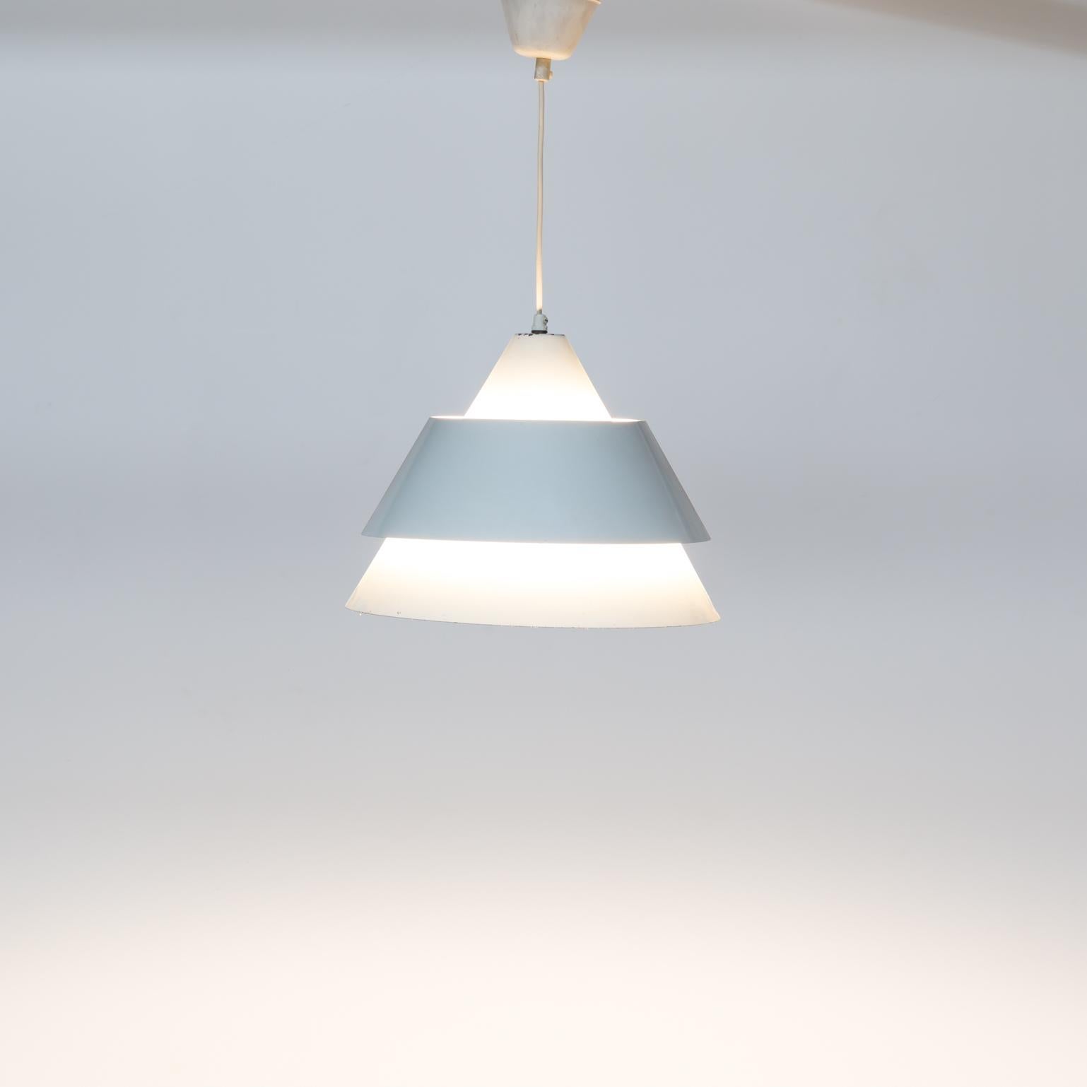 1970s white metal hanging lamp, pendant. Beautiful light projection through the metal. Good and working condition consistent with age and use.