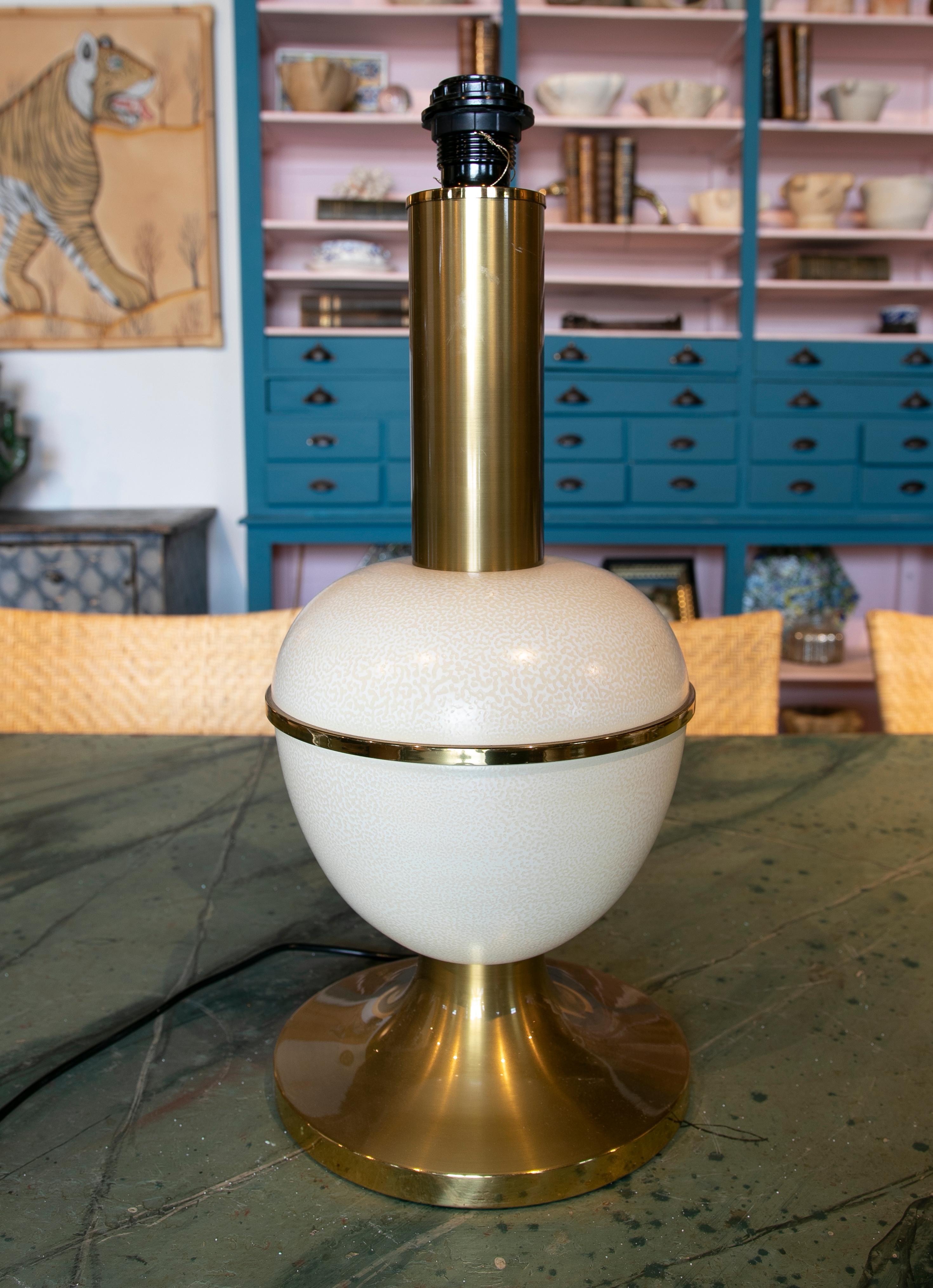 1970s white metal table lamp imitating ostrich eggs.