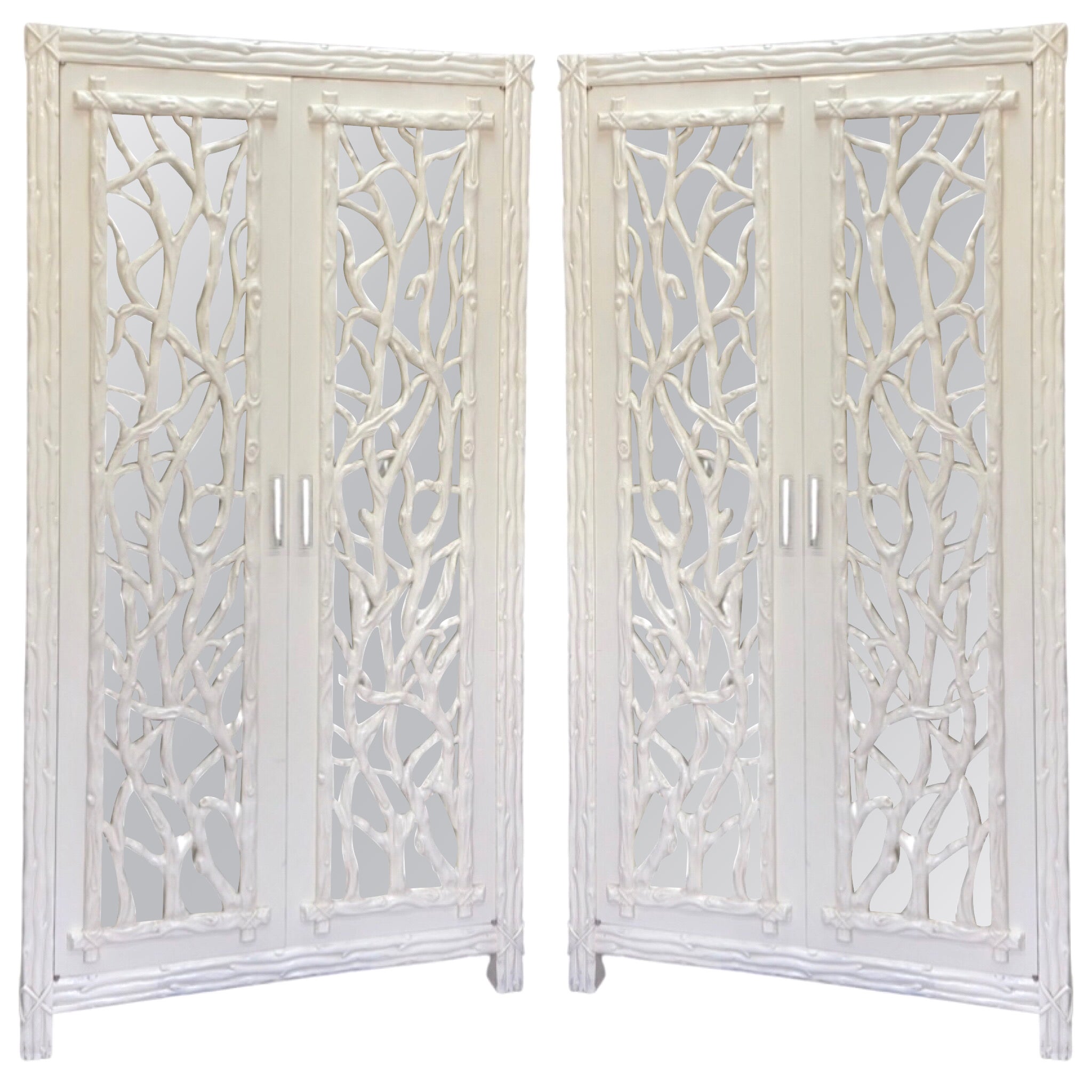 I love this! This is a pair of late 1970s or early 1980s armoires with mirrored doors and faux bois panels. They have incredible storage capacity with their 5 drawers and 9 cubbies. The pulls are lucite and appear to be original. The panels are