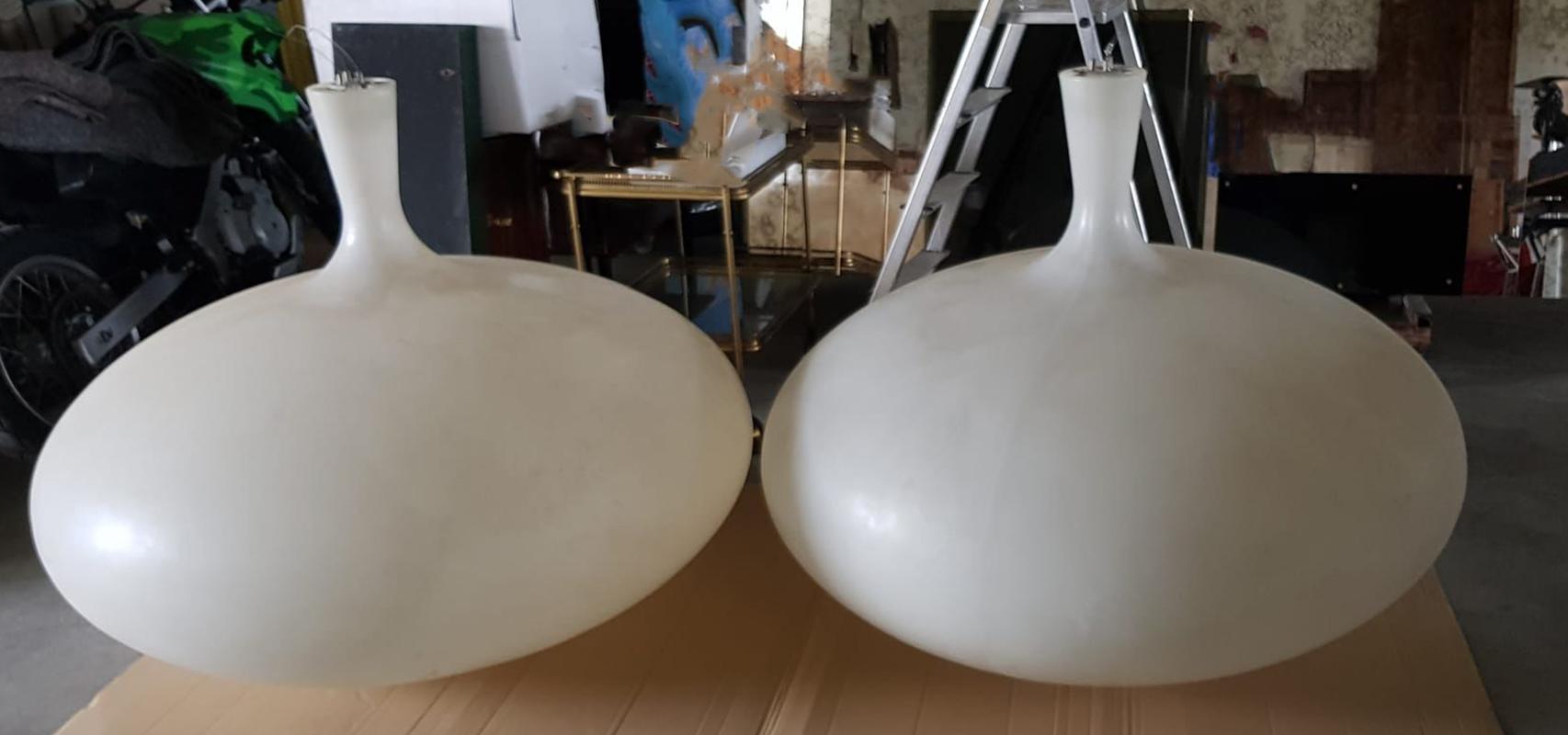 Chandeliers from a 1970s disco club.
They are made out of white resin and they measure diameter 130 cm height cm. We have two available now.
They features neon lights.
We have cleaned and no restoration was needed.

Shipping all over the world.
Zip