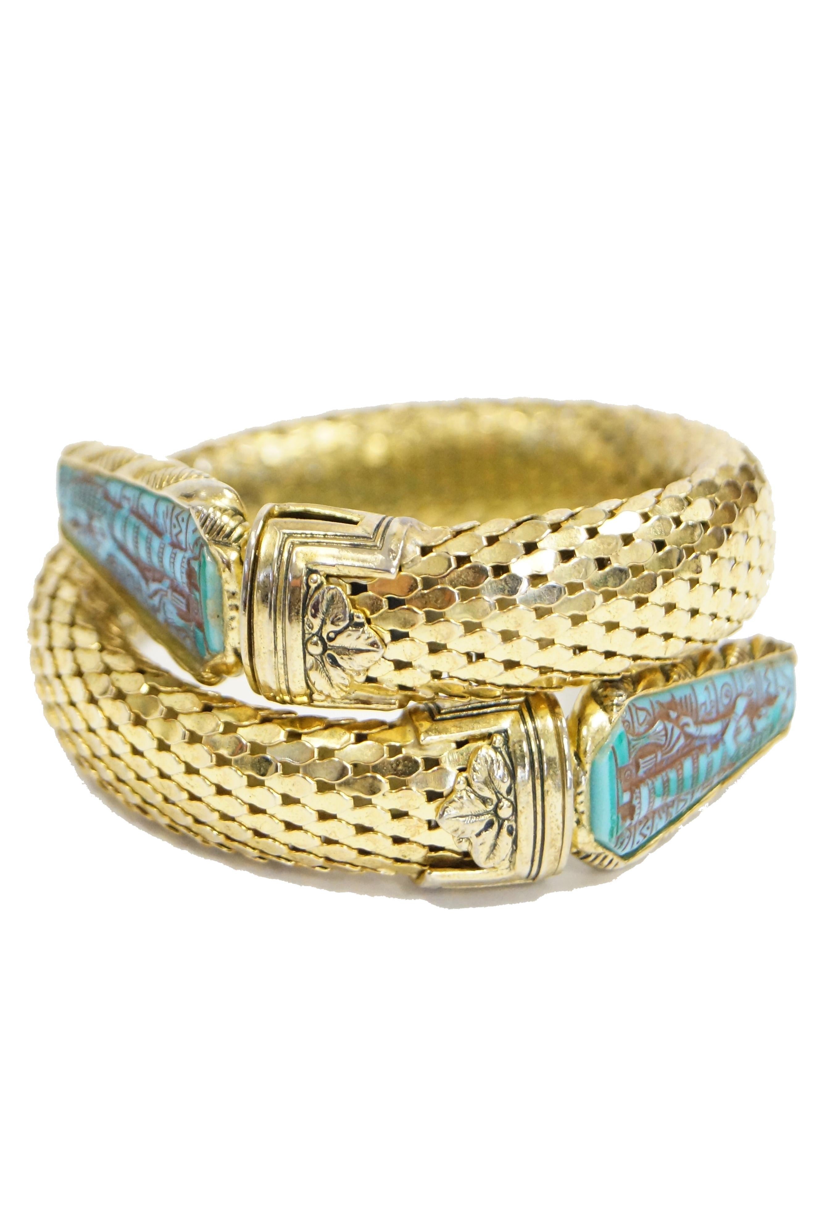 Striking Egyptian revival bracelet and earrings set by Whiting & Davis. The bracelet features the classic Whiting & Davis chainmail coil - present in many of their designs, most famously their snake coil bracelets- tipped with blue faux turquoise