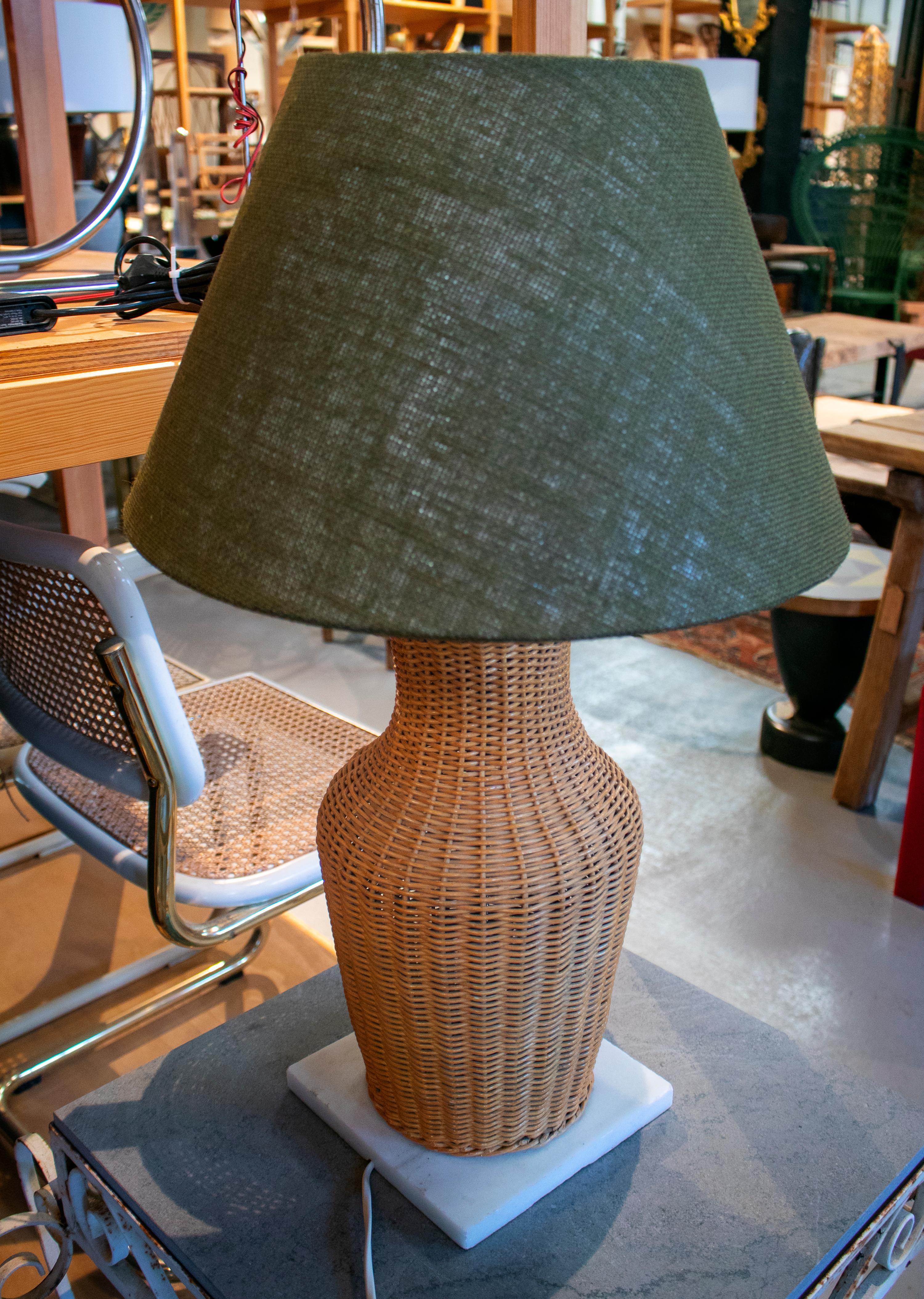 1970s wicker lamp with green shade on square white marble base.