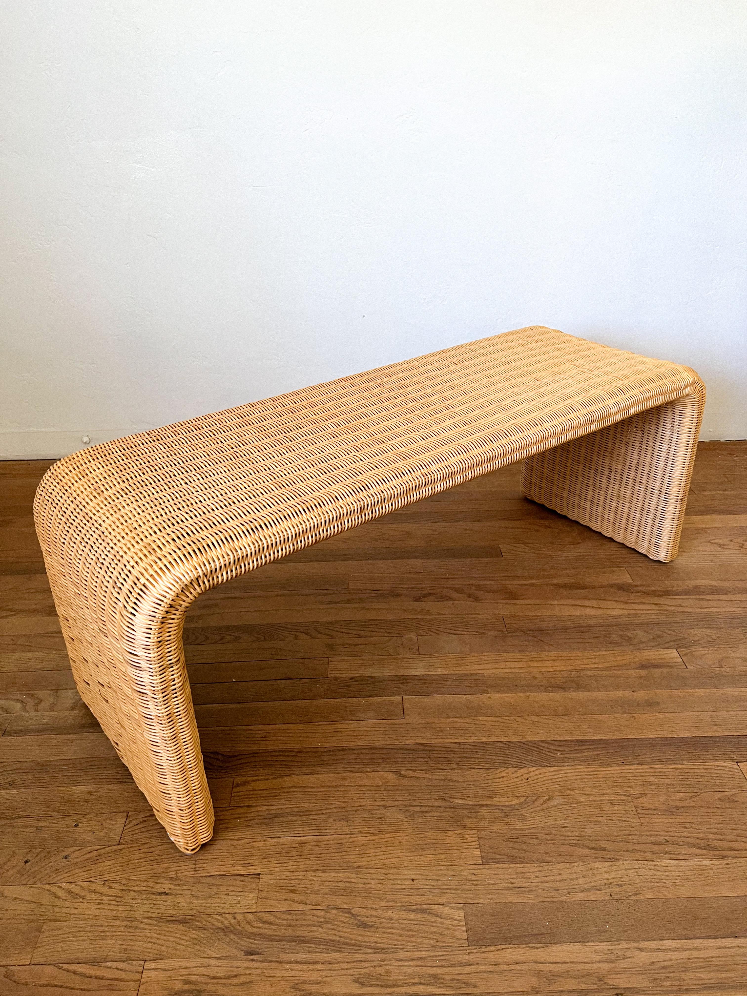 Vintage bench or ocasional table made of handwoven wicker.