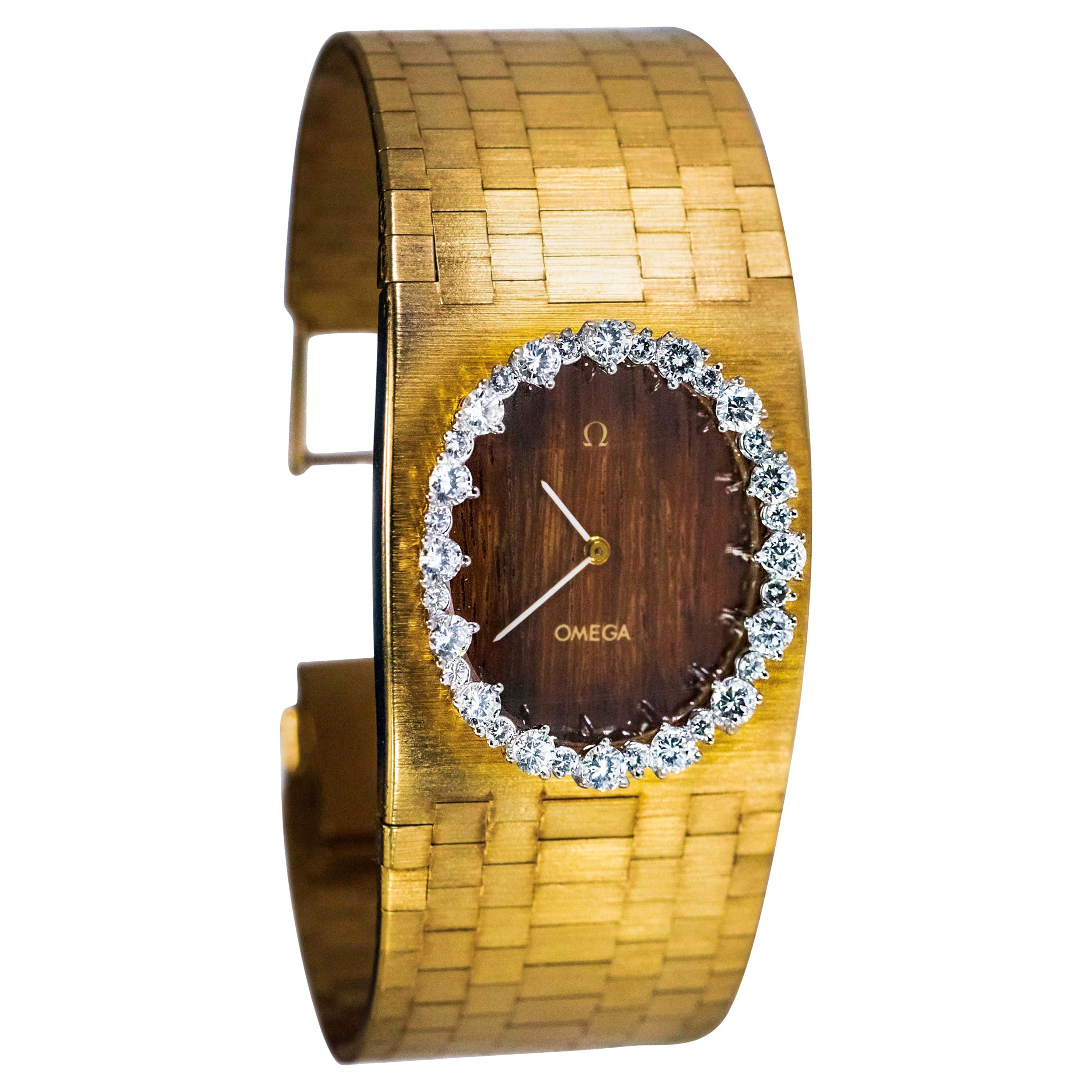 1970s Wide Omega Diamond Teak Wood Dial 18 Karat Yellow Gold Bangle Cuff Watch