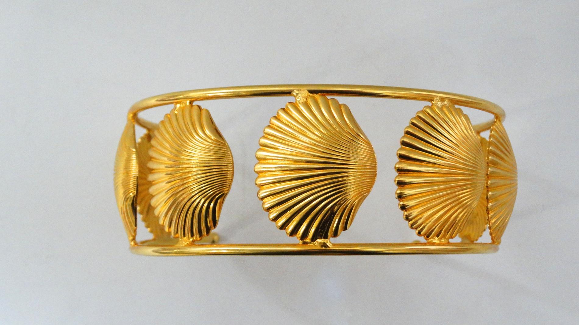 The Perfect Choker To Elevate Your Look Is Here! Circa 1970s, this William de Lillo statement choker is a U shape for easy wear and is plated gold. Features scallop seashells around choker. Has beautiful detail and structure. The perfect piece for