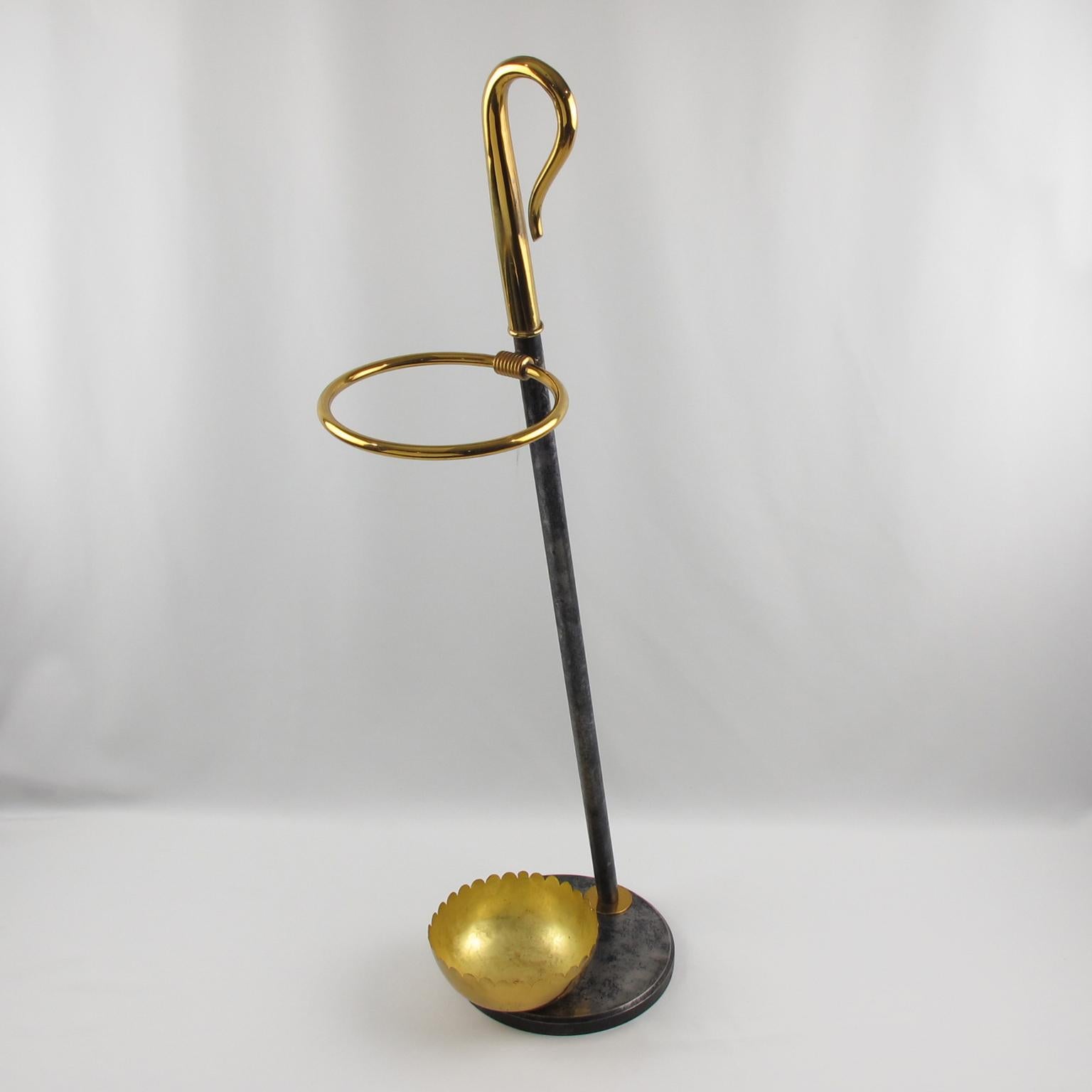 Stunning swan neck shaped umbrella stand reminiscent of the work of Willy Daro. This umbrella stand has a heavy cast iron base with a gilded brass bowl. The body of the umbrella stand is off-axis with polished brass and same cast iron with unique