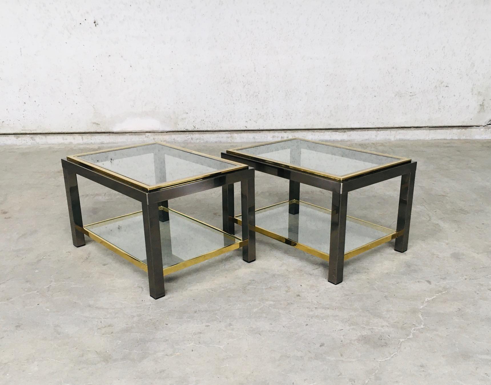 Postmodern Italian design in the style of Willy Rizzo sofa ends two tier side table set of 2. Made in Italy, 1970's. Brushed metal & brass & chrome construction with clear glass tops. Two tiers both in clear glass. All original set. Both are in very