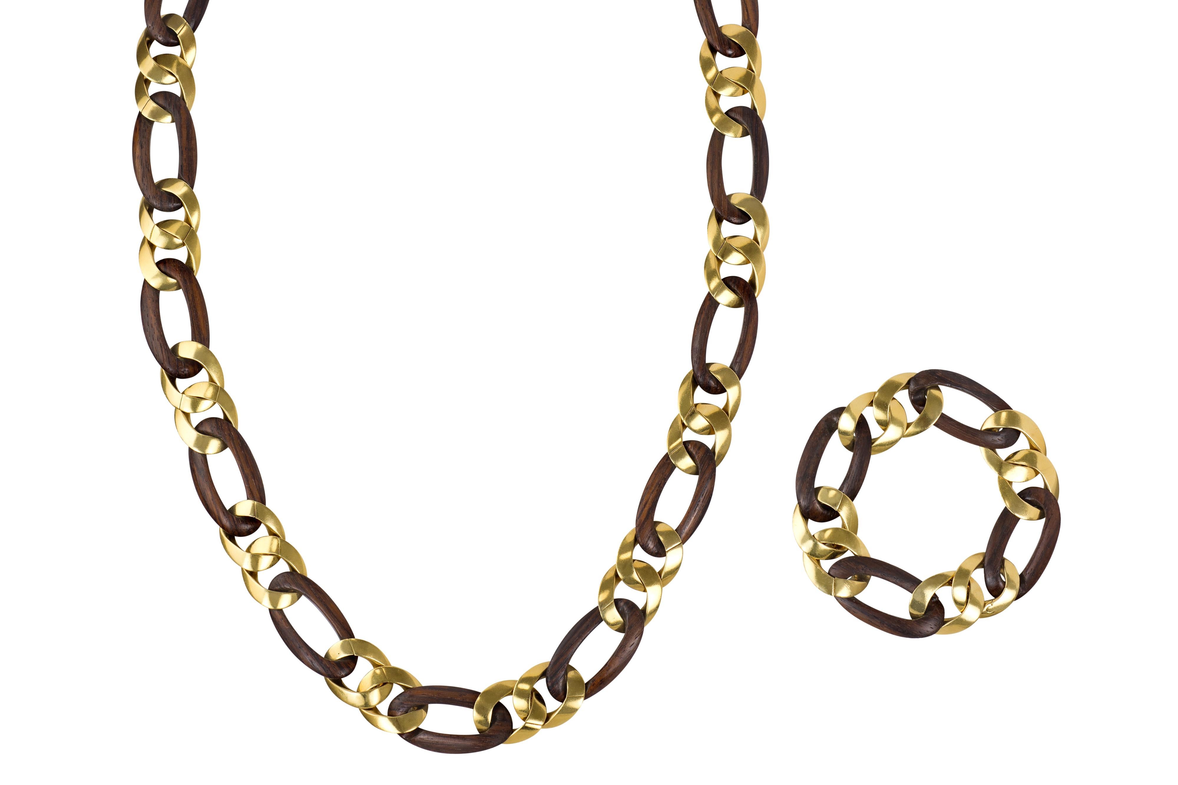 A wood and 18 karat gold sautoir, with detachable bracelet, 1970s. The necklace length is 25.75
