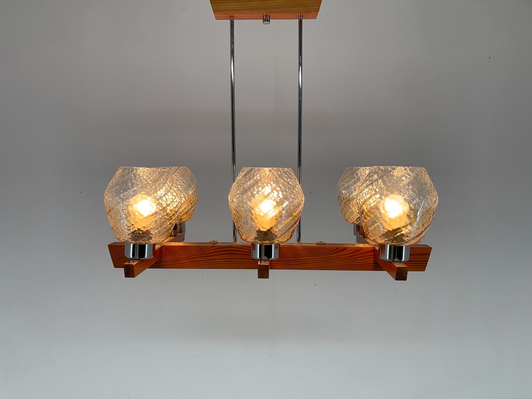 Wooden chandelier made in the 1970's by Elektroinstala Decín (labeled). Good vintage condition. Bulbs: 6 x E25-E27.