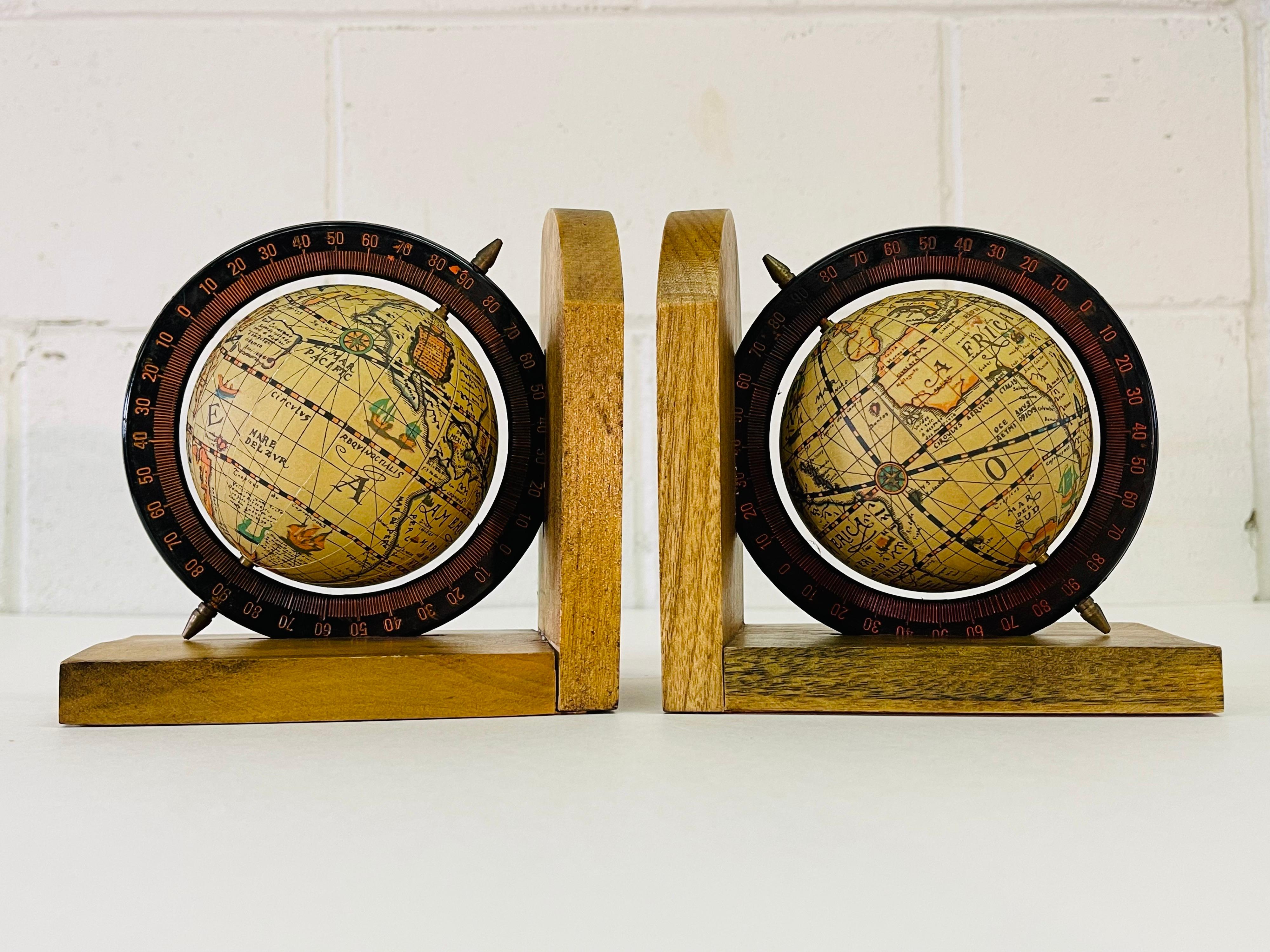 Vintage pair of 1970s world globe wood bookends. No marks.