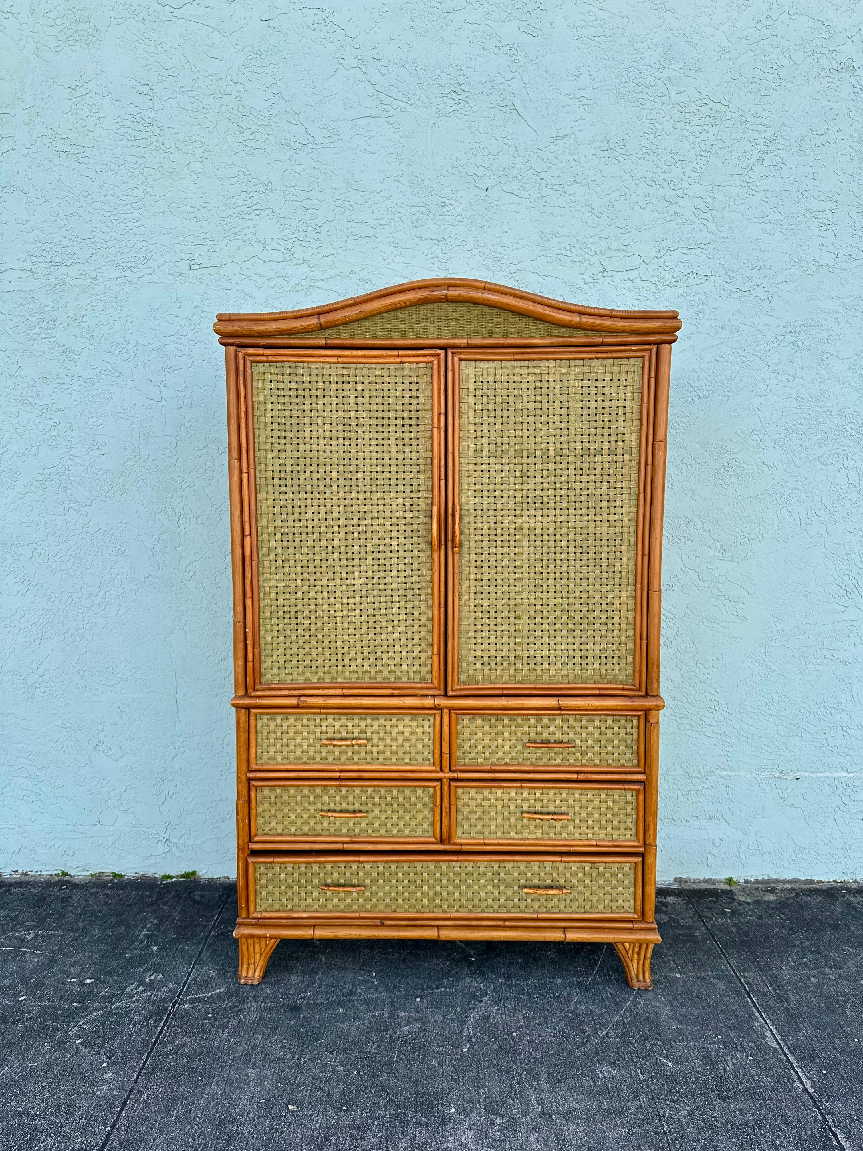 On offer on this occasion is one of the most stunning, rare rattan wardrobe cabinet you could hope to find. Outstanding design is exhibited throughout. The beautiful cabinet is statement piece and packed with personality!! Just look at the gorgeous