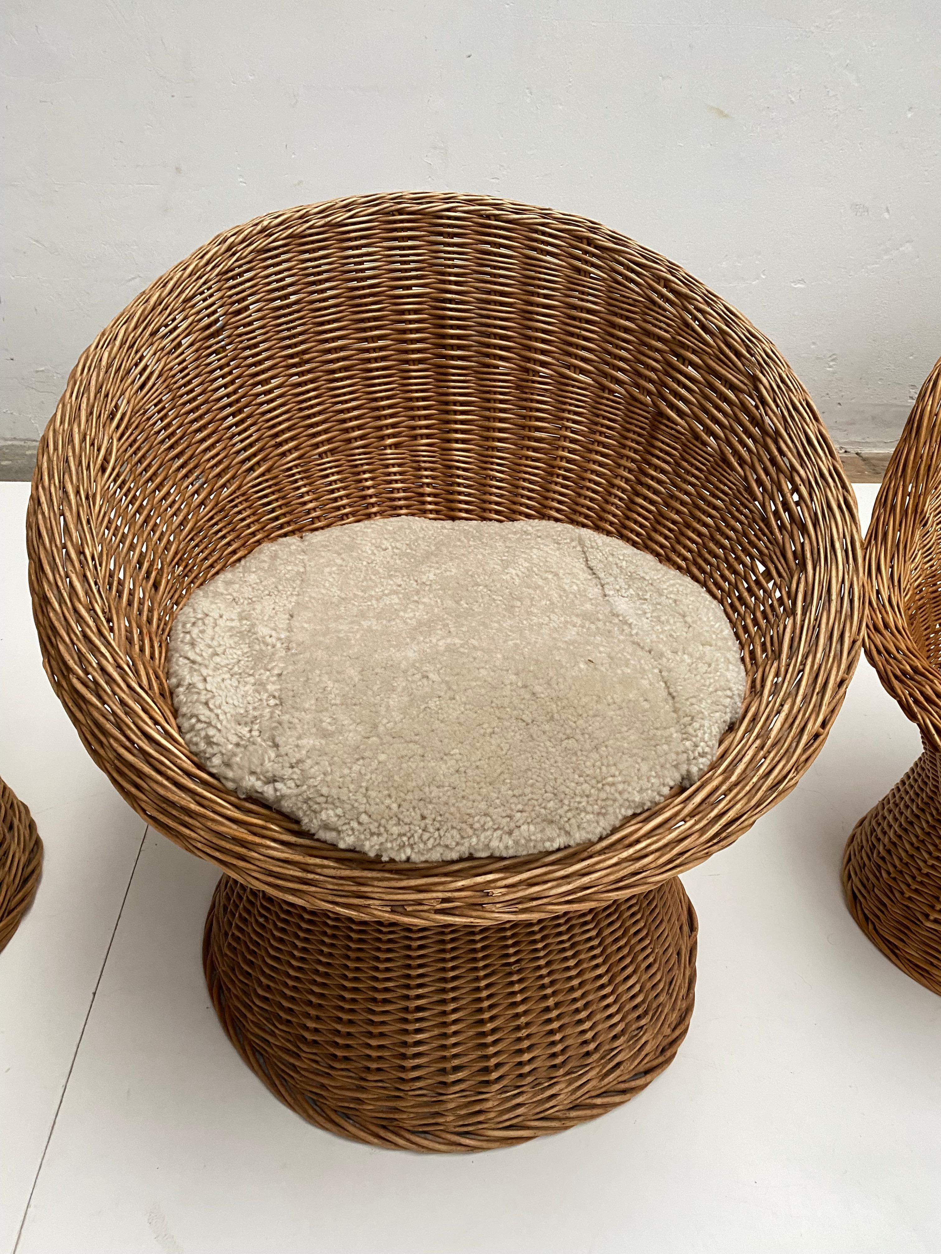 Late 20th Century 1970's Woven Wicker & Sheepskin Cushion Papa, Mama, Child Lounge Chairs + Table