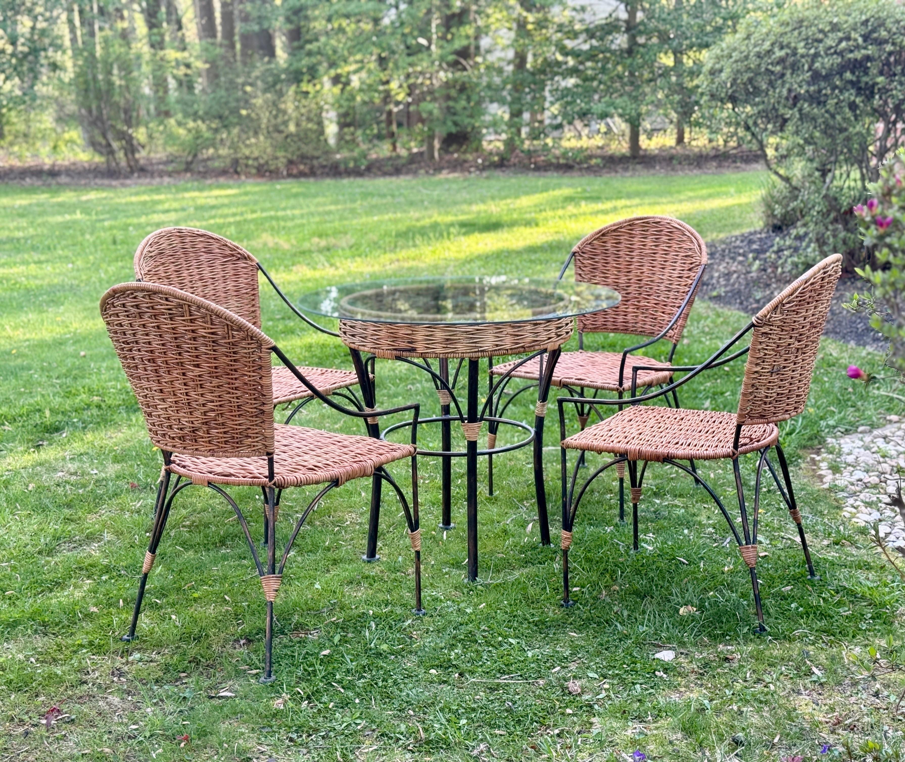 A stunning 5 piece wrought iron and wicker porch set.

Table Dimensions: 30.5 x 24

Chairs Dimensions: 36.5 x 20 x 24

