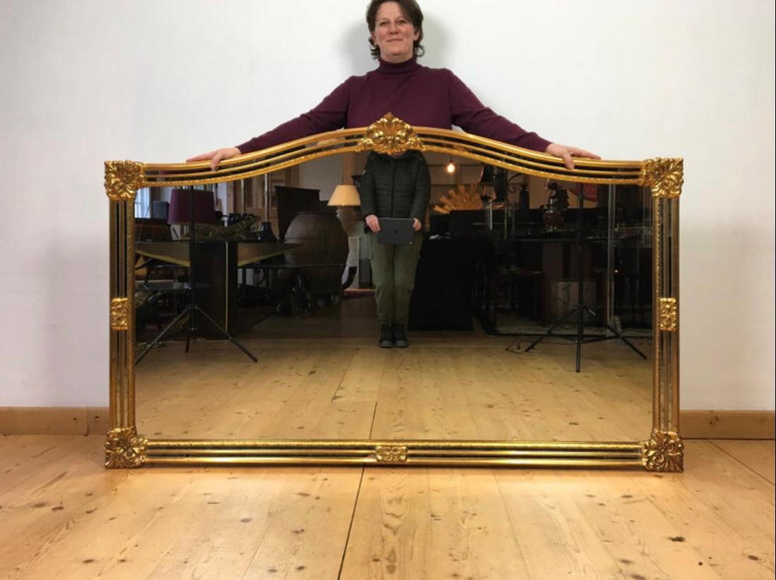 Stylish XL wall mirror by Deknudt Belgium. 
Deknudt Luxury High Quality mirrors Made in Belgium. 
This XL gilded mirror dates from the 1970s. 
It's a large Hollywood Regency mirror with gold colored frame and faceted glass in the border. It's a
