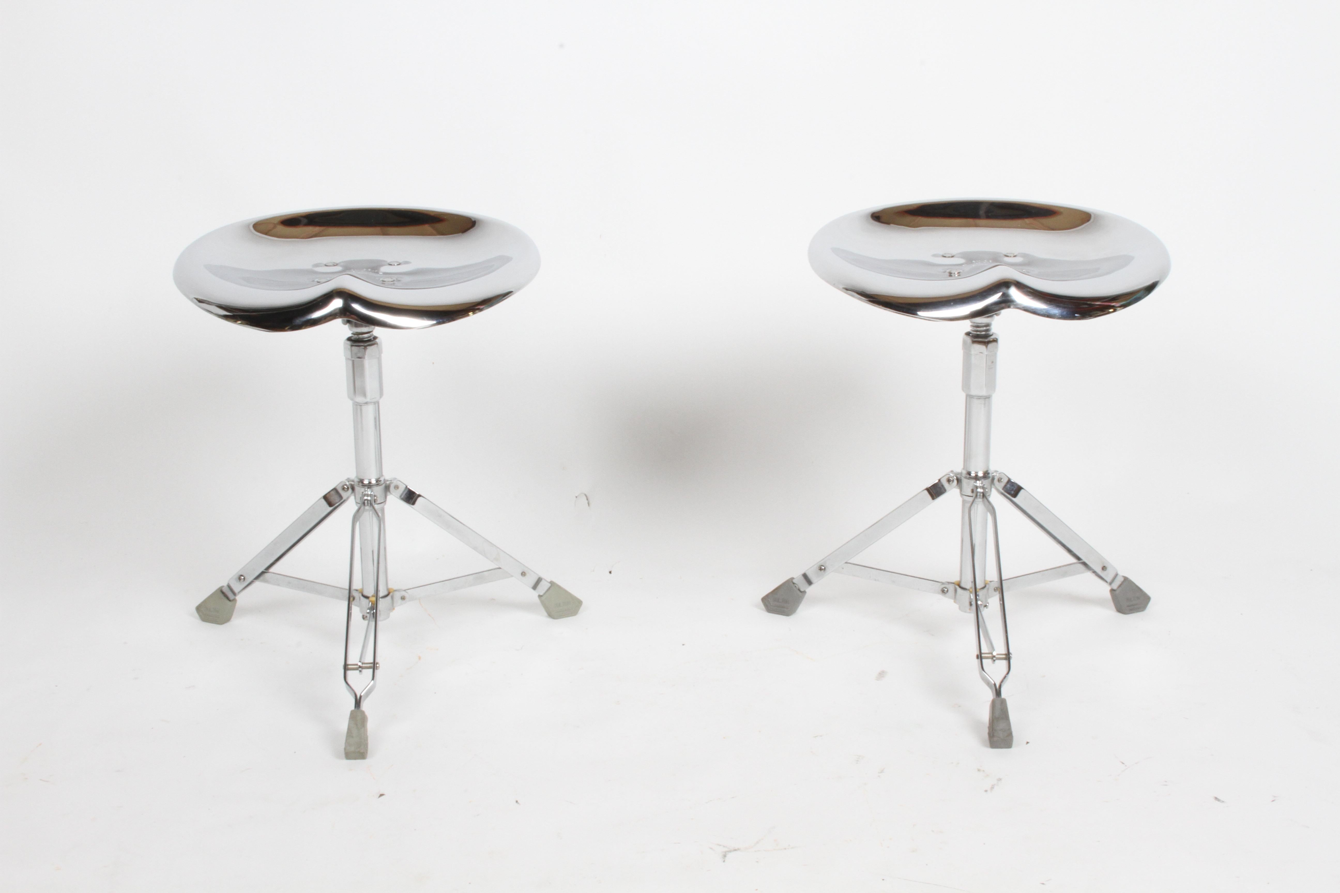 1970s stainless steel molded tractor seat on drum set throne stool base by Japanese designer Yasuaki Sasamoto and produced by Dulton Co. Rare early design. Maker's mark engraved underneath the seat.  Fully adjustable and  collapsible, height adjusts