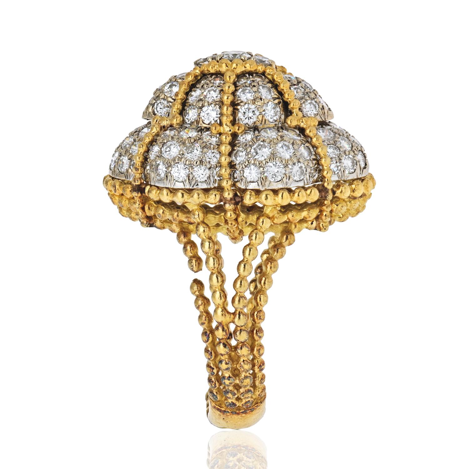 A vintage 18K yellow gold diamond bombe ring. This spectacular retro ring consists of a domed cluster of brilliant-cut diamonds claw set on a split double rope twist wire shank - a bold shiny statement, this stunning ring is sure to be