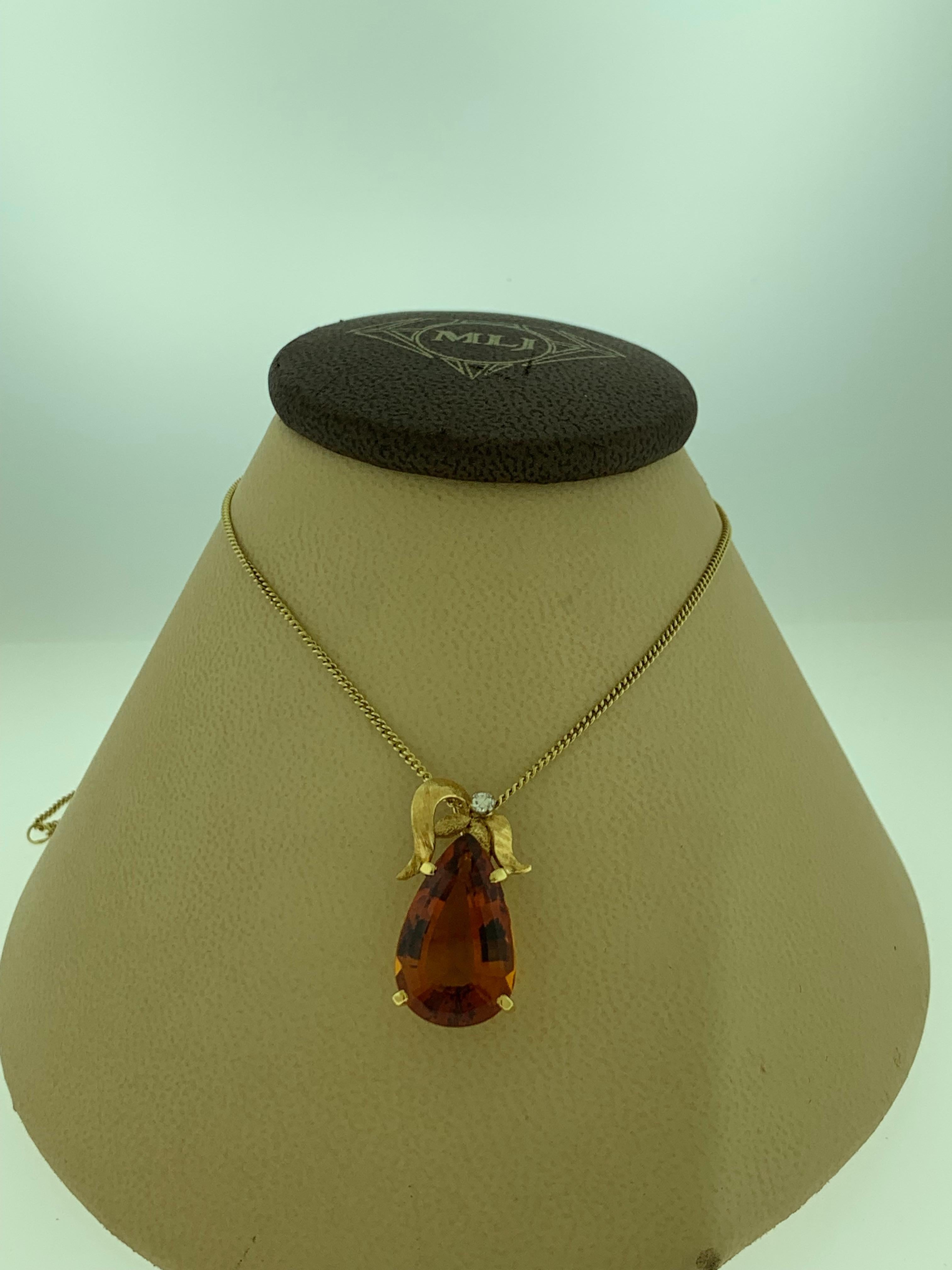 1970's Yellow Gold & Imperial Topaz pendant Necklace by H Stern 18K Yellow Gold 
This spectacular Pendant Necklace  consisting of a single  Pear Shape Imperial Topaz approximately 11.5 Carat  exhibiting a fine deep/vivid orange body color. There is