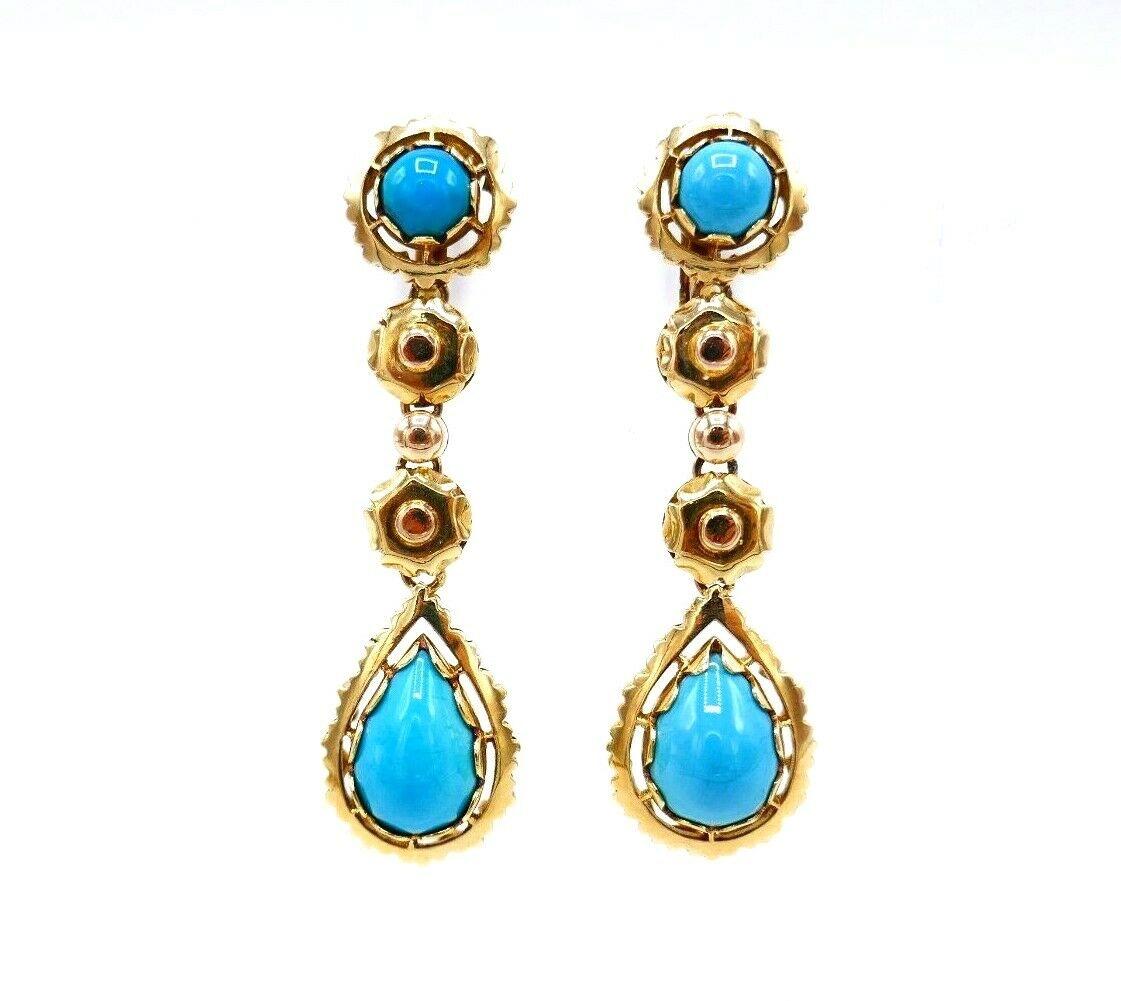 A beautiful vintage set features necklace and earrings made of 18k yellow gold and cabochon turquoise. The earrings are clip-on (posts can be added). The necklace has a box clasp.  
Both stamped with a hallmark for 18k gold.
Measurements: the