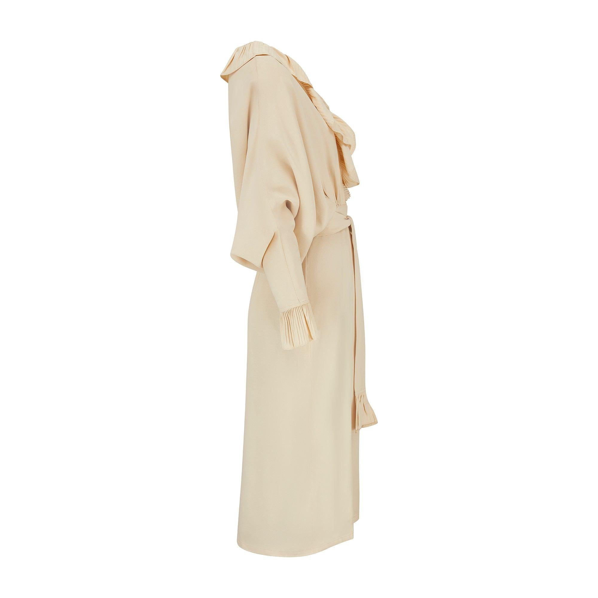 This elegant dress was designed by Yuki for British store Rembrandt during the 1970s. Made in the UK, it is crafted from a high quality crepe cloth in a rich cream hue. This dress celebrates Yuki’s canny tailoring; his signature cut was to craft