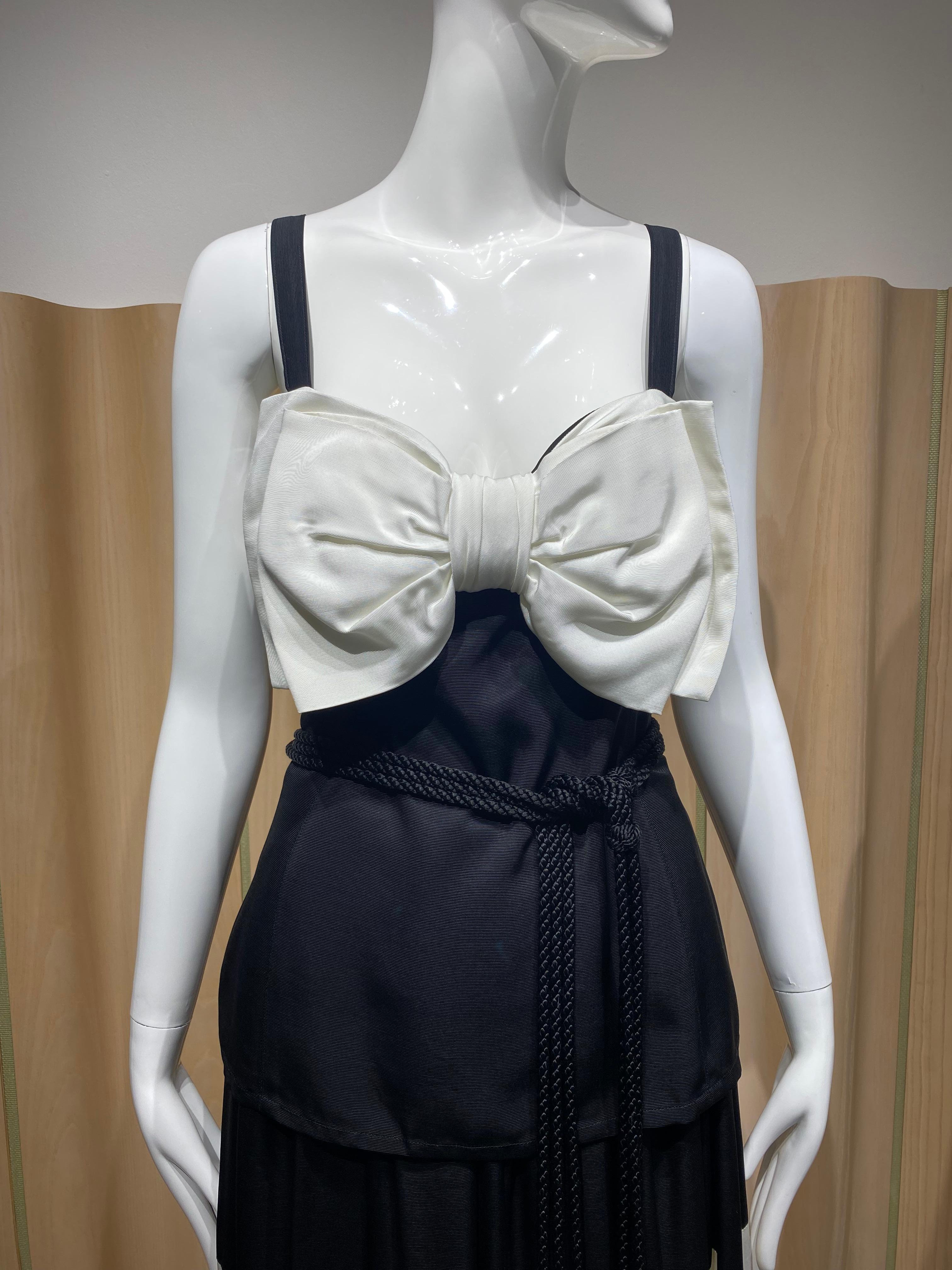1970s Saint Laurent by Yves Saint Laurent 2 pcs spaghetti strap top with bow and black and white maxi skirt and robe belt.
marked size 38 , fit us size 2/4

