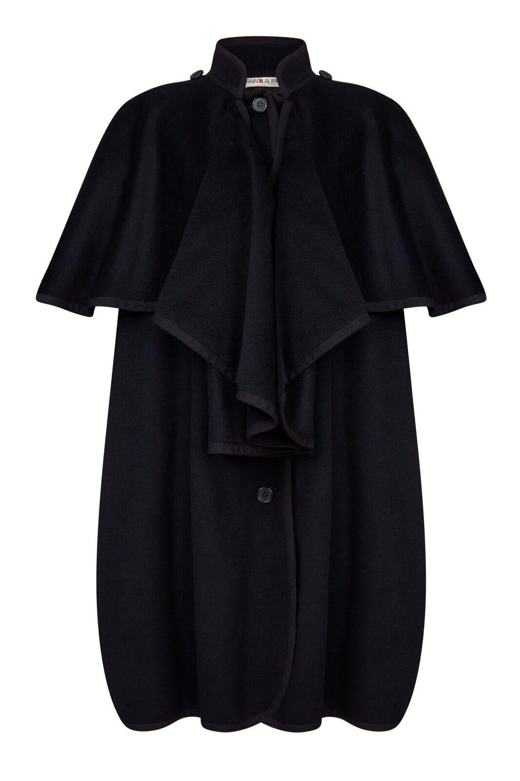 This magnificent 1970s Yves Saint Laurent black wool cape excites drama and style and can be worn two ways, varying the impact of the piece. The soft wool felt is cut almost exclusively from one length and artfully fashioned to create a double tier