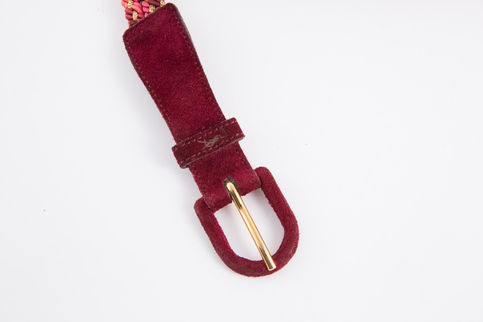 1970s bordeaux suede Saint Laurent belt featuring a  a pink, bordeaux and gold tone braided part, a bordeaux suede leather part, YSL pitted on front loop, inside logo stamp.
In good vintage condition. Made in France. 
Label size 75
Total maximum