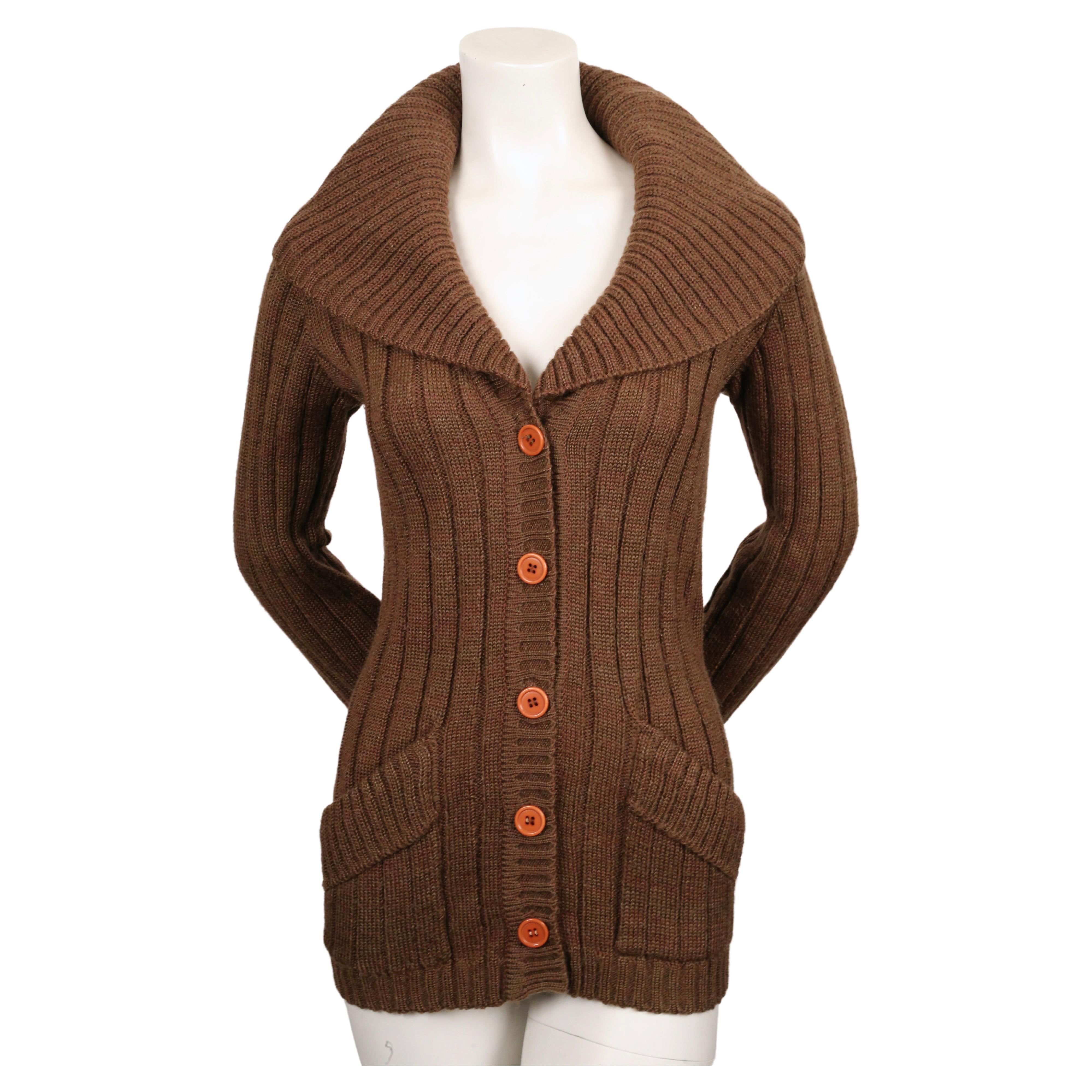 Brown, ribbed cardigan sweater with oversized shawl collar designed by Yves Saint Laurent dating to the 1970's. Labeled a size 