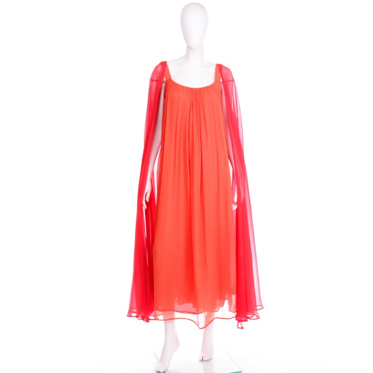 We absolutely adore this sensational vintage 1970's Yves Saint Laurent couture evening gown. This quintessential 1970's dress is in a free flowing Grecian style. This show stopper of a dress was designed by Yves Saint Laurent and is such a special