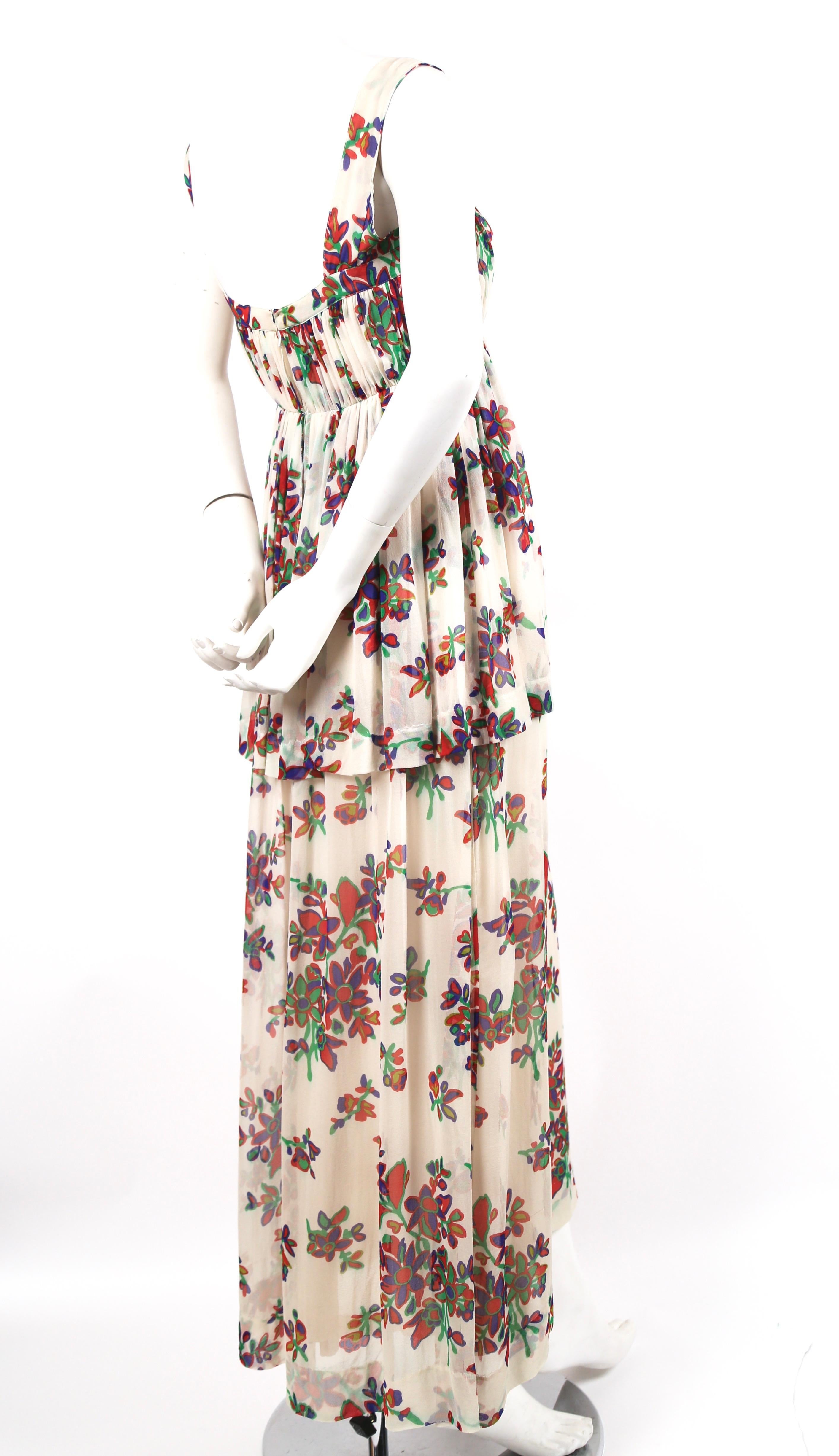 Delicate, floral printed, silk chiffon summer dress designed by Yves Saint Laurent dating to the 1970s. Best fits a size 4 or 6. Approximate measurements: bust 32-33