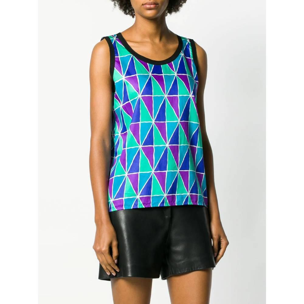 Yves Saint Laurent top in cotton with geometric print in shades of green, purple, turquoise and blue, with round neckline and edges finished in black grosgrain.Years: 70s

Made in France

Size: 42 FR

Linear measures

Height: 60 cm
Bust: 46 cm