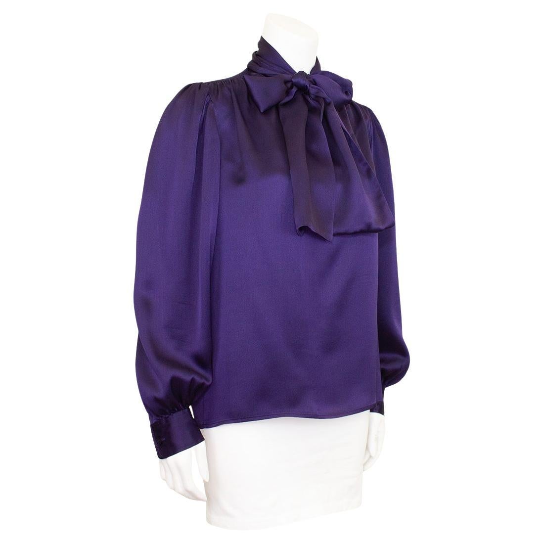 A classic that never goes out of style, this YSL Rive Gauche label silk blouse from the late 1970s is in excellent condition. Single loop button closure at the neck, luscious silk pussy bow and button cuffs. Marked a FR 36, fits like a US 2/4.