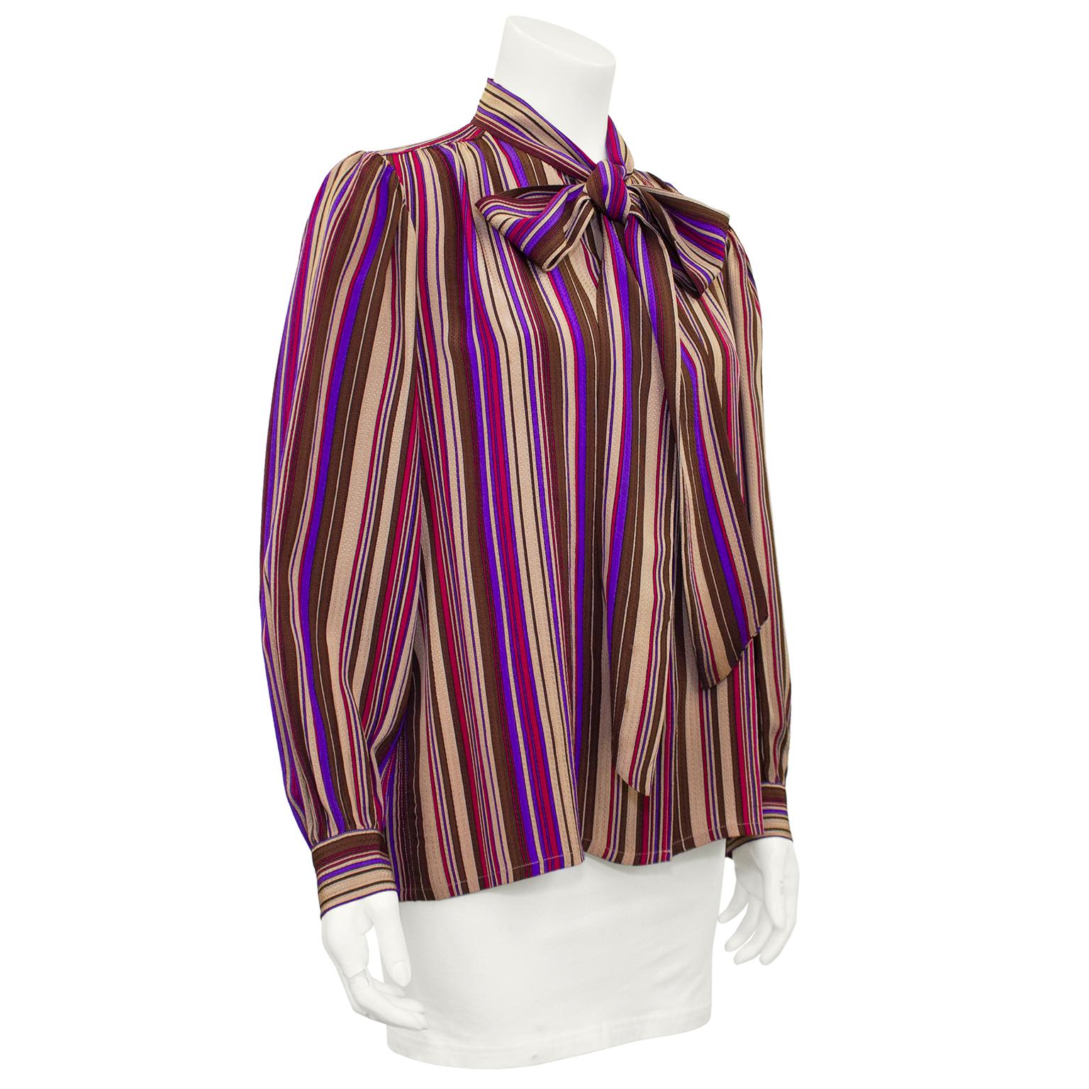 1970s Yves Saint Laurent Rive Gauche blouse. Purple, brown, tan and red vertical stripe silk jacquard with a pussybow and bishop sleeves. Buttons up centre front. Excellent vintage condition. Marked FR 36, fits like a US size 4-6. Made in