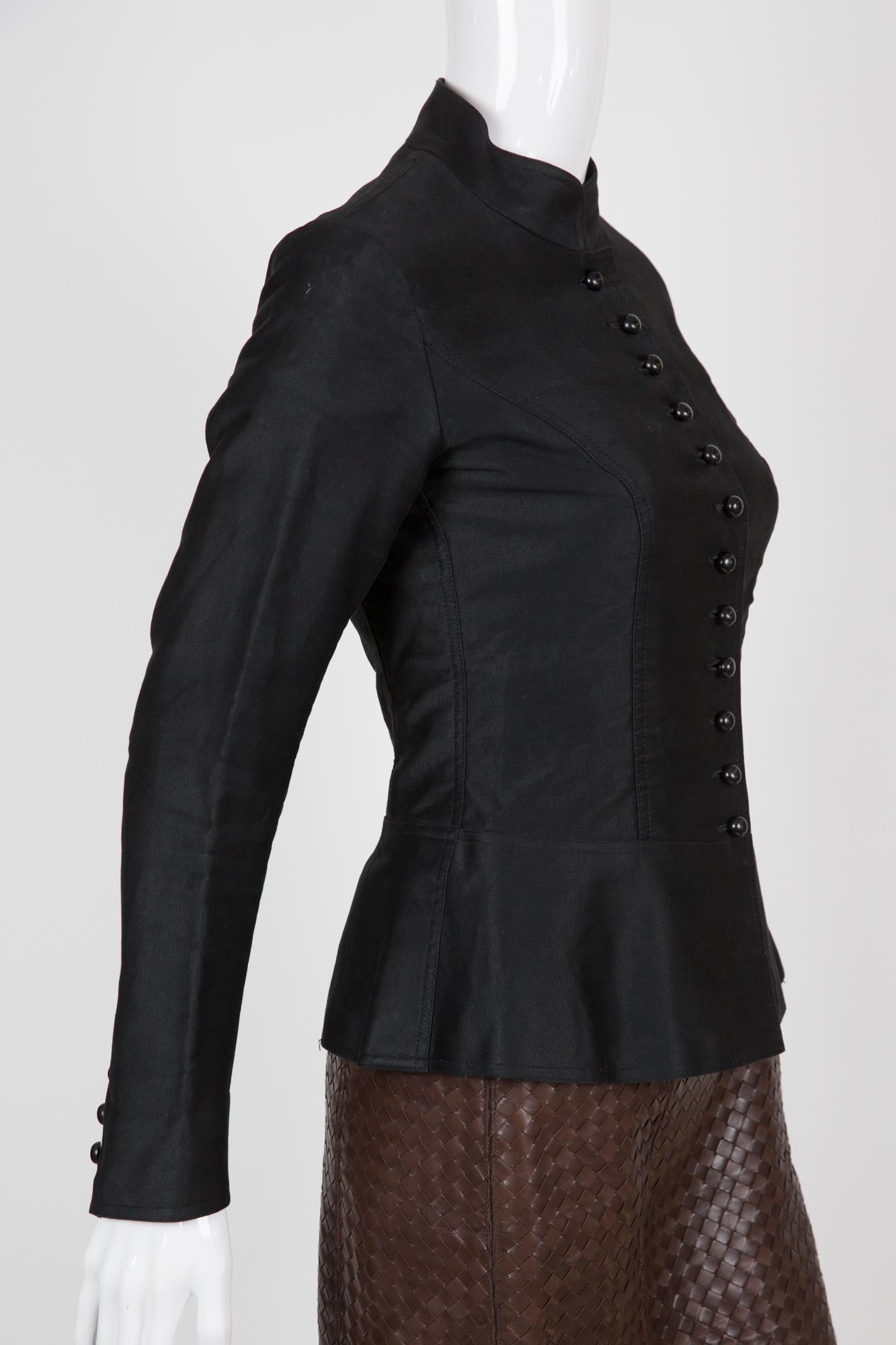Rare, Yves Saint Laurent YSL black  jacket featuring a Mao collar, rounded buttons, a bottom basque and long sleeves with buttons at cuffs. 
Circa 1970s Spring/Summer
Composition: 100% cotton
Estimated size 36fr/ US4/ UK8 and Estimated size 38fr/US6