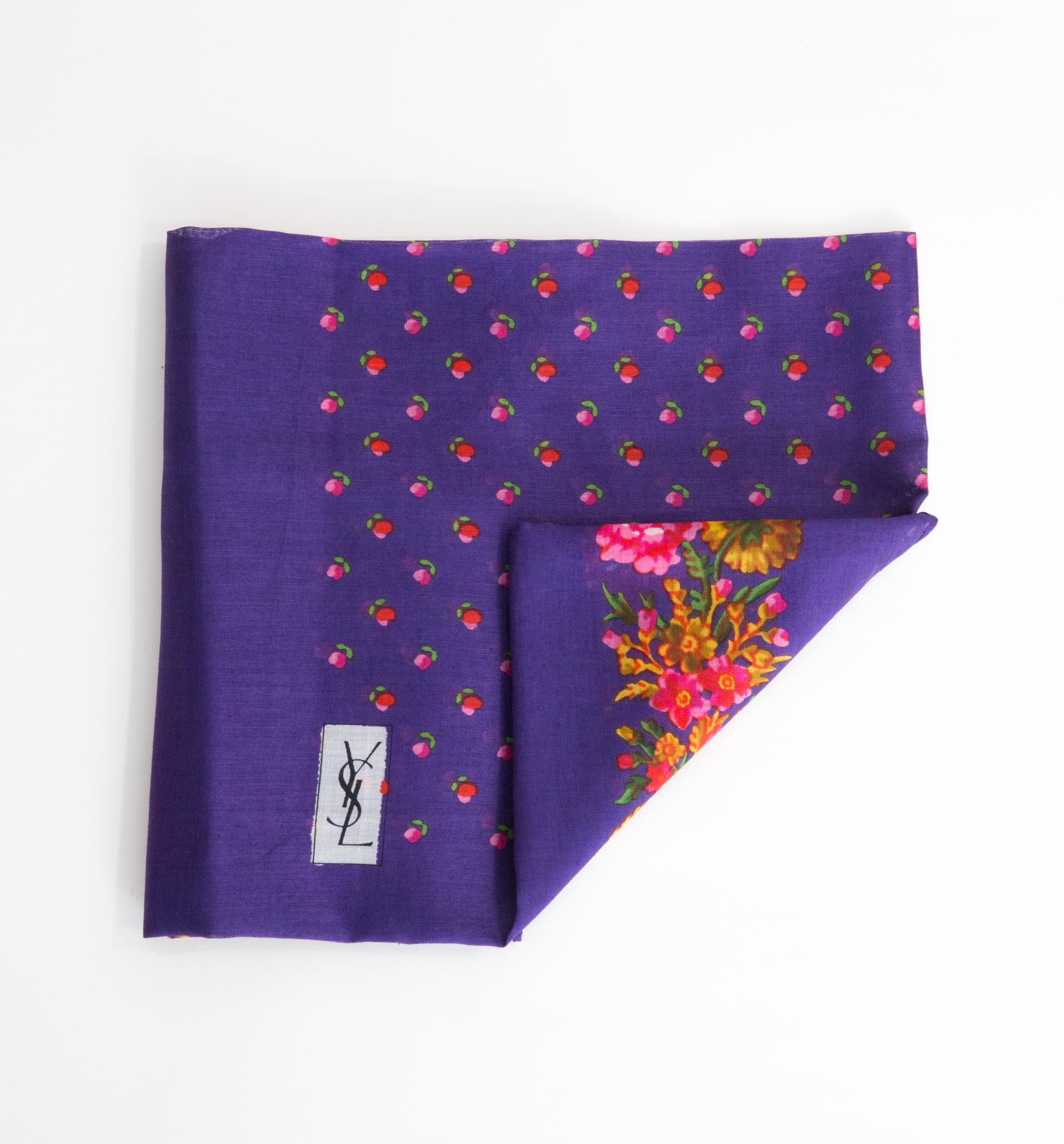 Yves Saint Laurent YSL cotton scarf featuring an iconic flower print, and a YSL signature. 
Circa 1970s
In good vintage condition. Made in France.
275 in. (70cm) X 275 in. (70cm)
We guarantee you will receive this  iconic item as described and