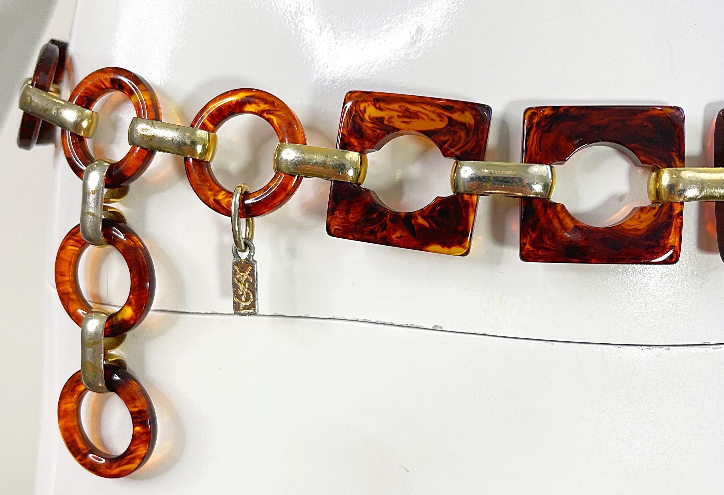 Chic vintage 70s YVES SAINT LAURENT YSL tortoise lucite link belt OR necklace ! Features square and circle tortoise links throughout. Throw over a blouse or dress. Can also be worn as a choker or strand necklace. 
In great condition 
Made in