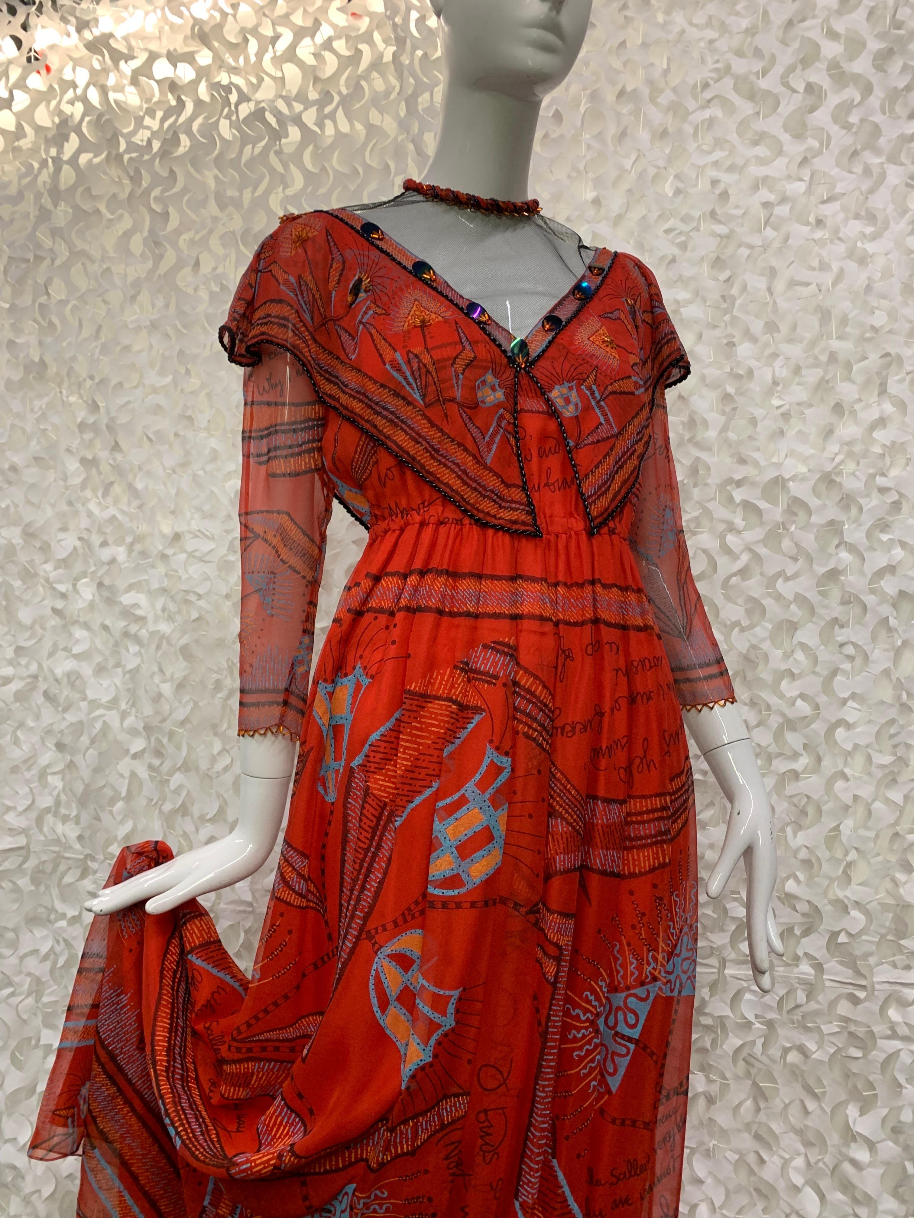 1970s Zandra Rhodes Red Silk Chiffon Print Boho London Maxi Dress w Bead Details.  Victorian revival style typical of Ms. Rhodes classics. Sheer black net décolletage, shawl-style draping at décolletage as well as bead and paillette detail trim.
