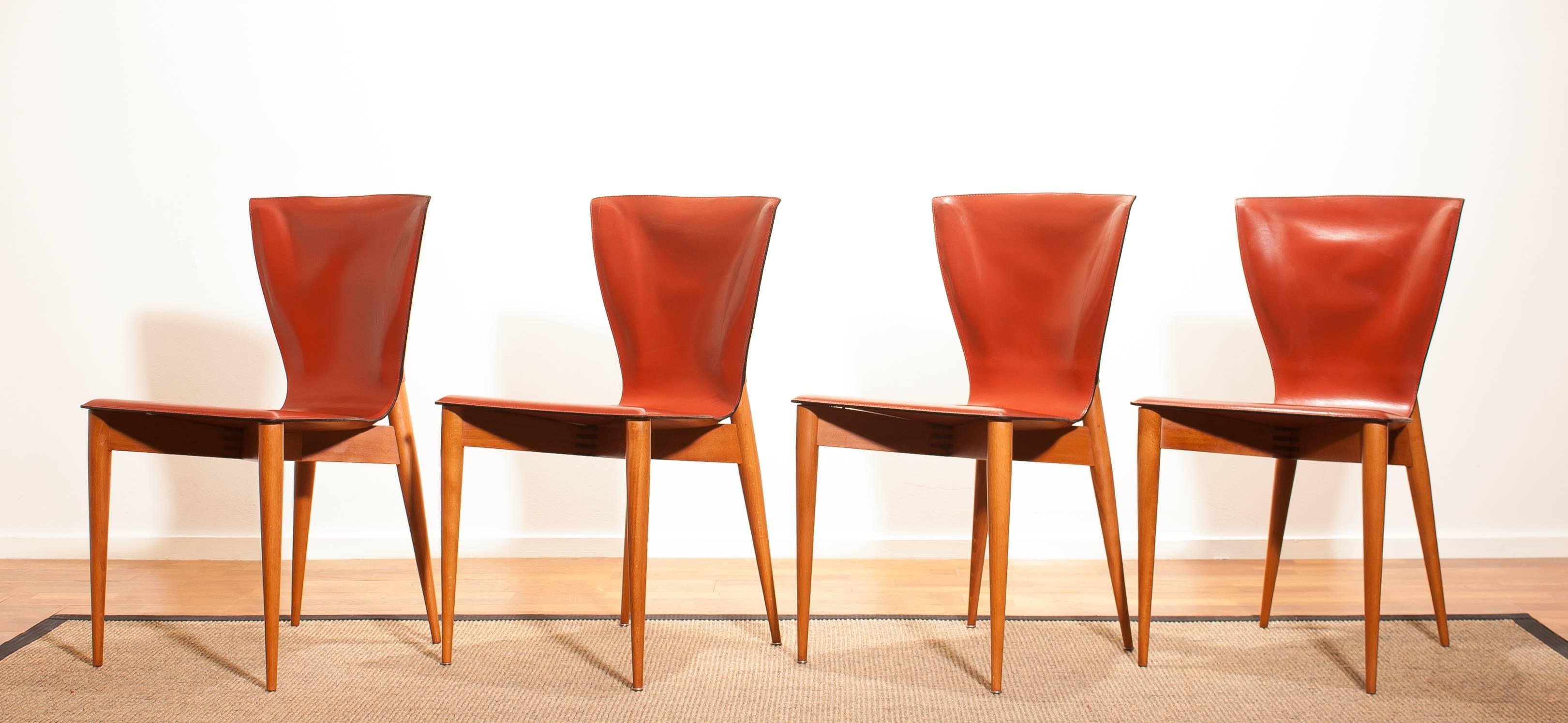 This set of four Mid-Century Modern chairs were designed by Carlo Bartoli and made by Matteo Grassi. 
They are made of hardwood frames with cognac brown Italian leather seats and backs.
The set is in a wonderful condition.
Period,