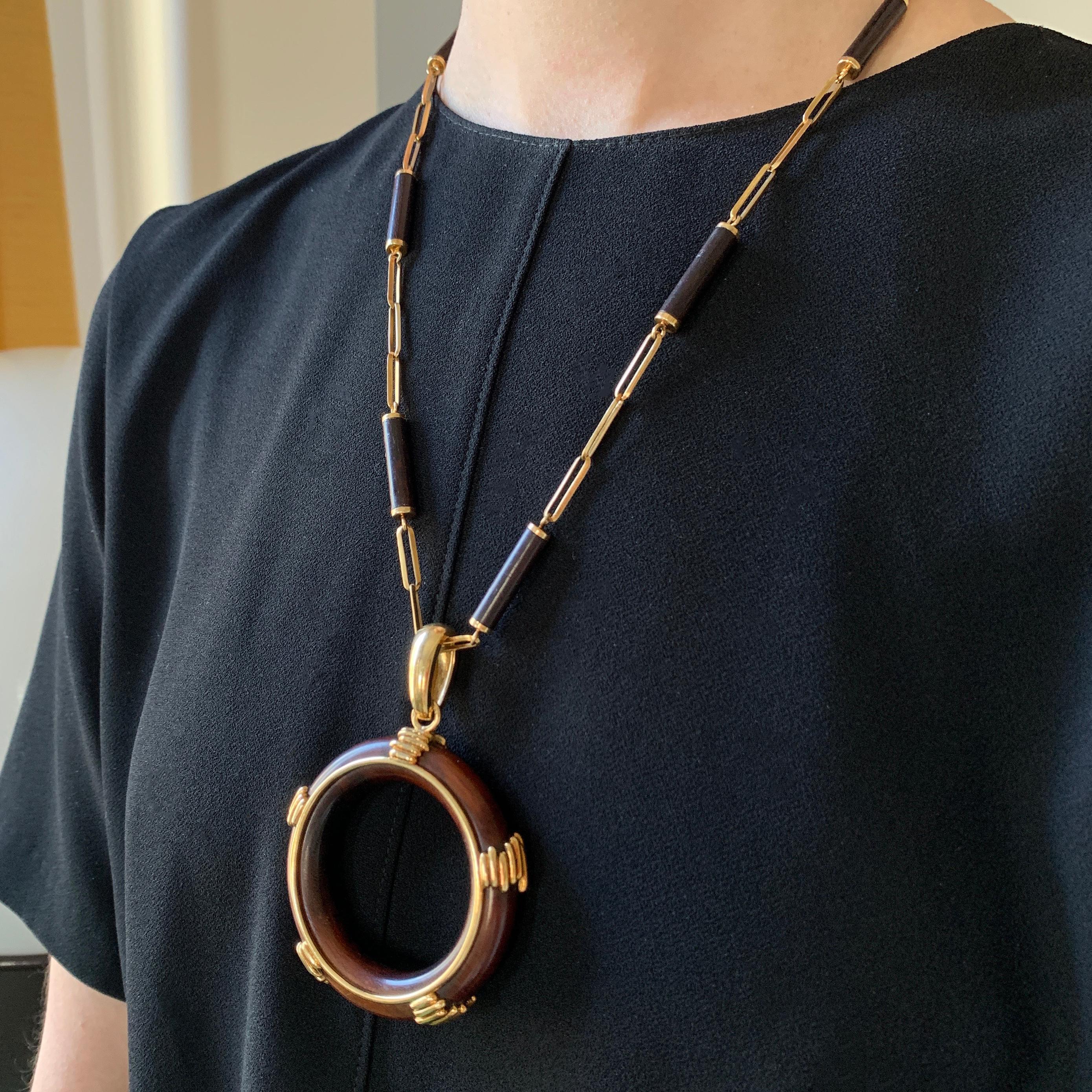 A wood and 18 karat gold necklace, by Asprey, 1971. 

The pendant can be removed and worn independently on a leather cord or chain of your choosing. 

The pendant is stamped with maker's mark 
