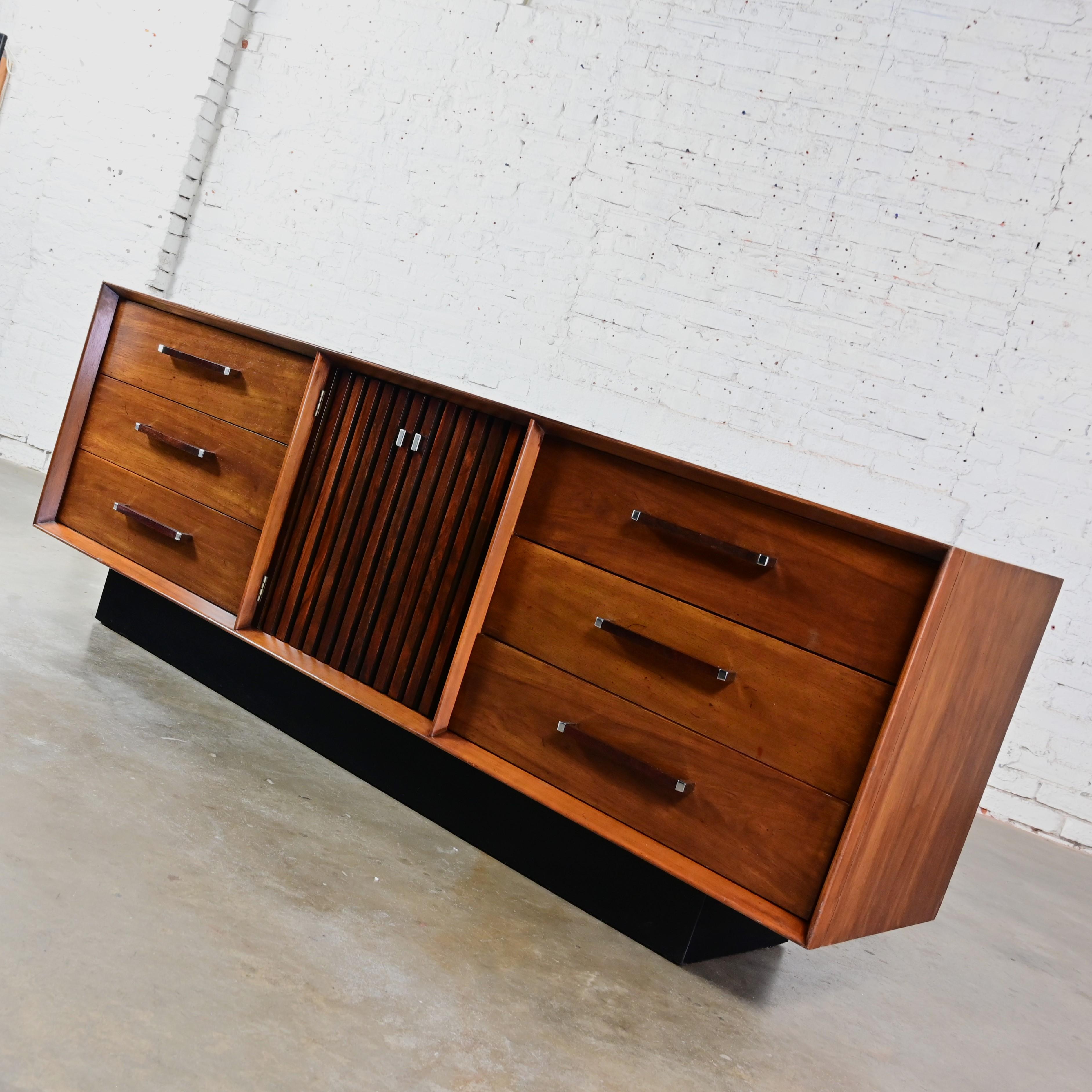 Spectacular vintage Mid-Century Modern dresser, credenza, buffet, or sideboard Lane Furniture Tower Suite Collection comprised of walnut, rosewood and chrome details, hardware, & door fronts, 9 drawers, and a black painted plinth base. Beautiful