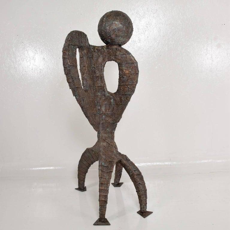 Fabulous Art Sculpture
Big Brutalist sculpture metal structure covered with composite in faux bronze finish. 
Style of Paul Evans
Unknown artist.
Signed RN 1971.
H 63 in. x W 20 in. x D 15 in.
Good Original Vintage Condition.
Refer to images.

