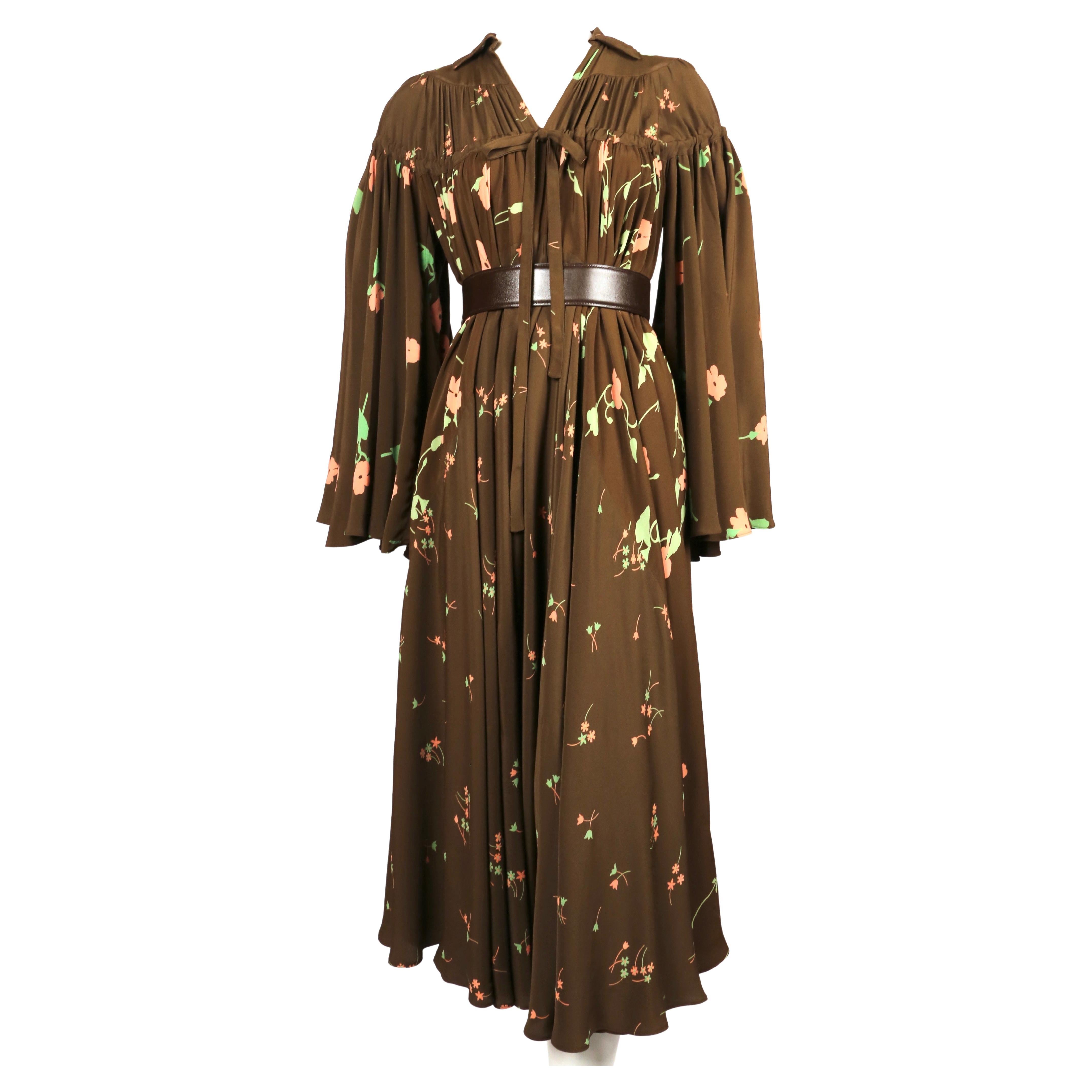 Very rare, brown crepe dress with Celia Birtwell 'busy-Lizzie' printed fabric and full sleeves designed by Ossie Clark for Quorum dating to 1971. Dress is marked a British size 10 however due to the full shape, it can accommodate many sizes.