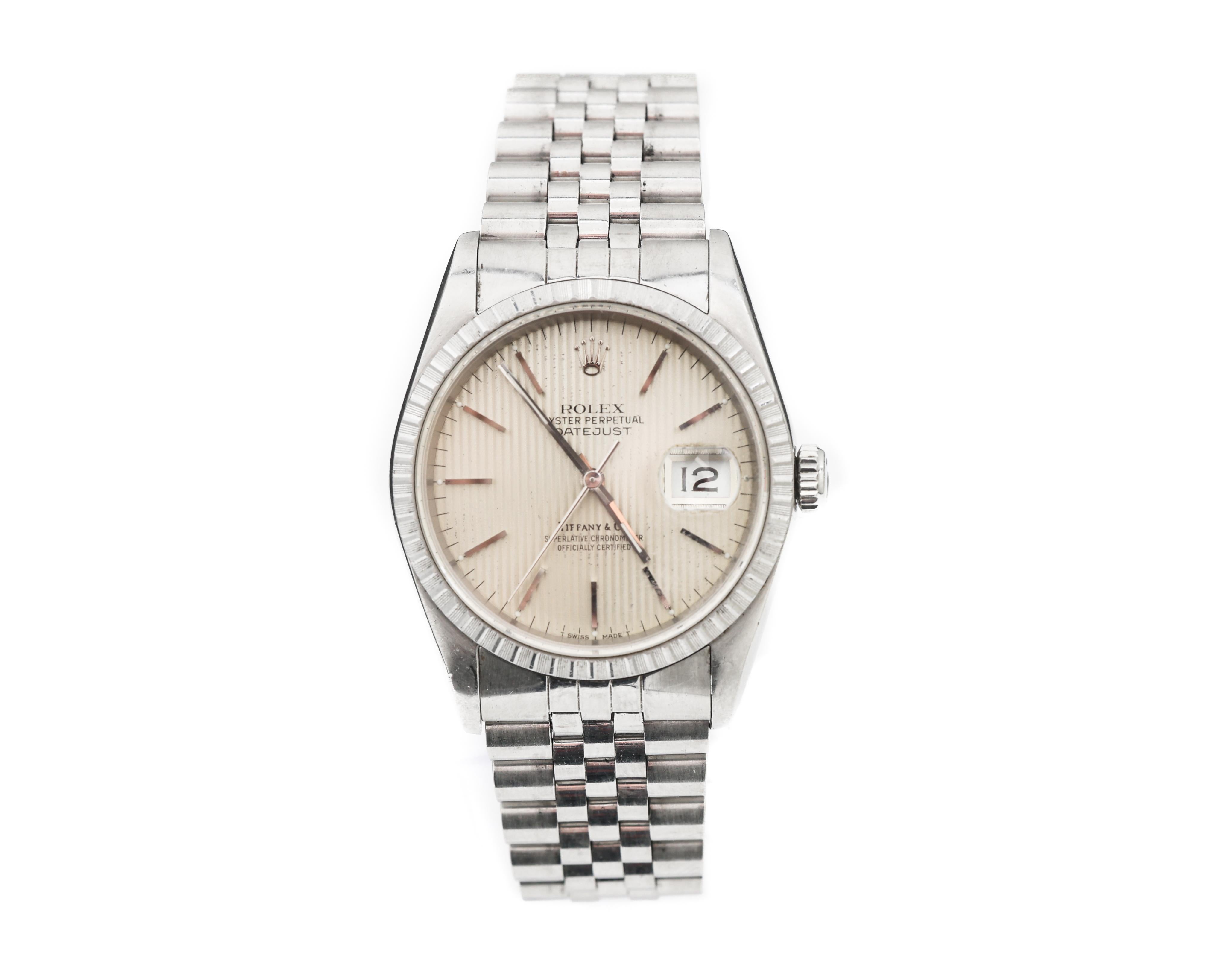 Era	        Modern
Brand	Rolex
Style	Datejust
Model	16220
Serial	EXXX,XXX
Material	Stainless Steel
Dial	Tapestry
Millimeters	36
Bracelet	Jubilee
Excellent silver Super Luminova dial with Tapestry pattern and matching hands