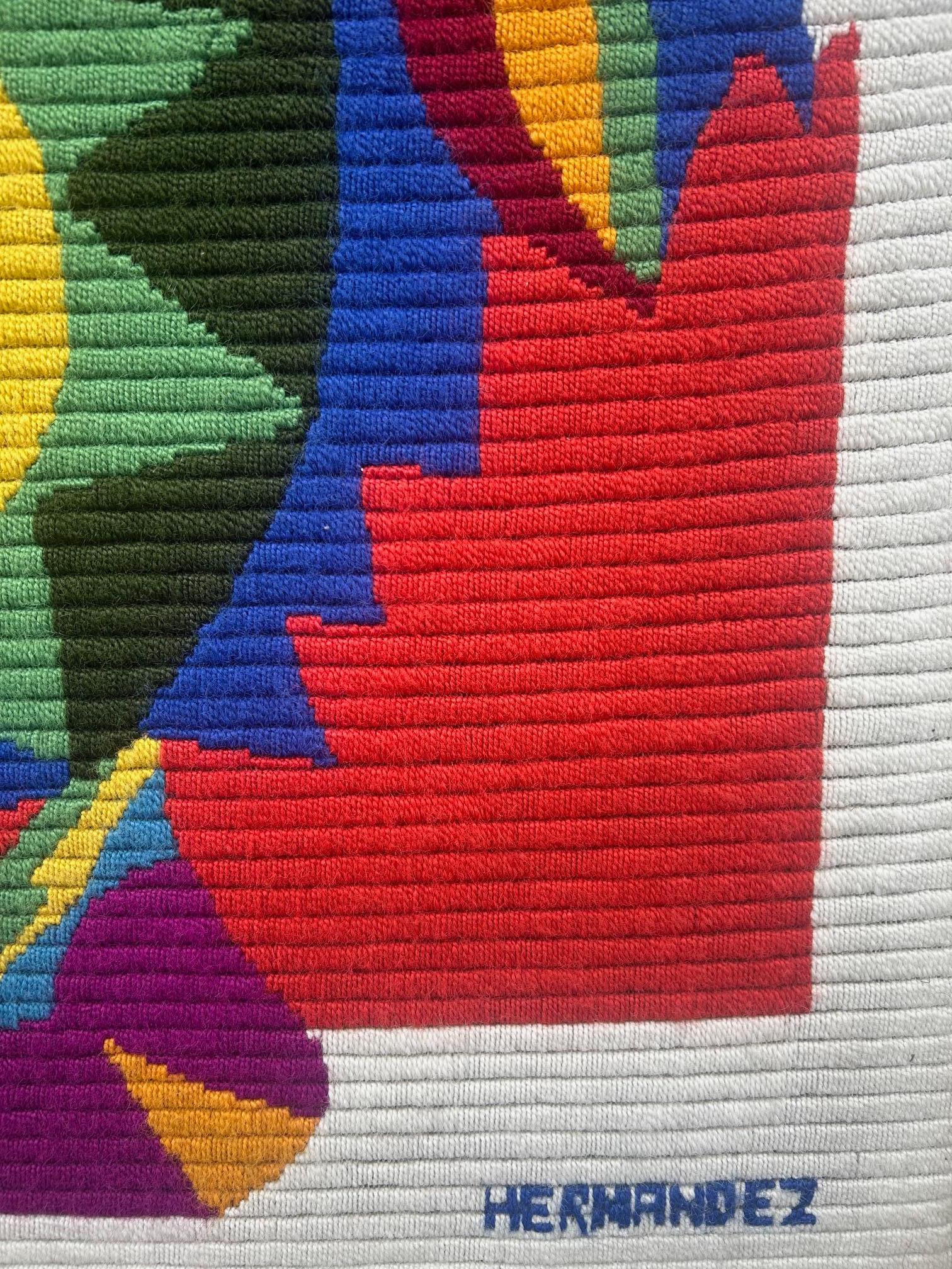 abstract tapestry with vibrant colours from the 1970's , hand knotted , design Mariano Hernandez , Spain 
Hernandez's work is inspired by Mirò