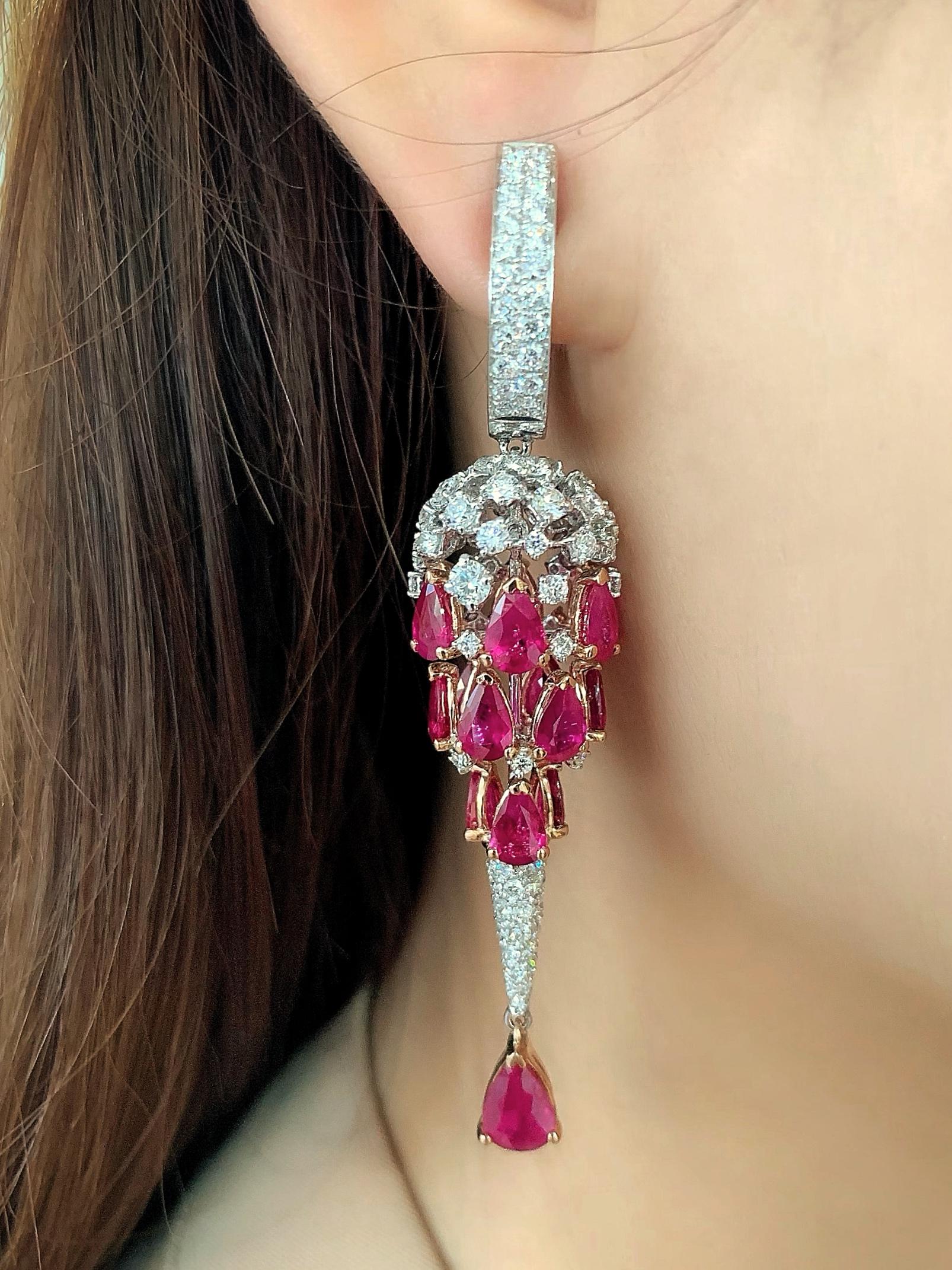 Butani's earrings are encrusted with over 230 brilliant-cut diamonds (totaling 4.79 carats) and 32 striking pear-cut rubies (totaling 14.93 carats) that perfectly accentuate the chandelier design.  Handcrafted in 18 karat white and yellow gold, the