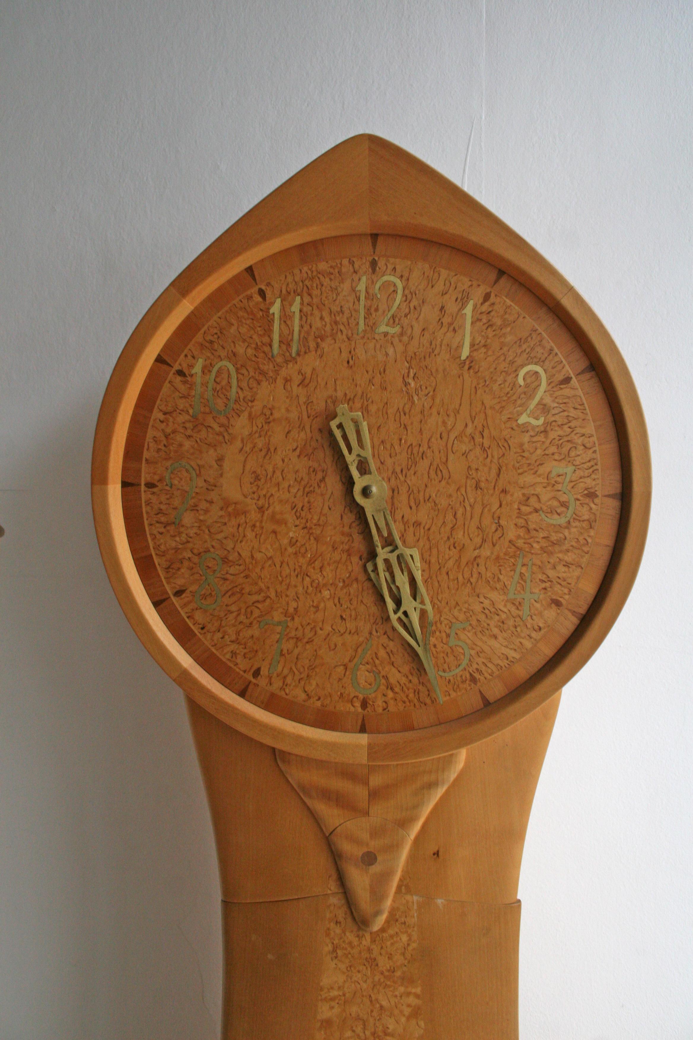 Carl Malmsten “Tidlösa” Longcase clock in Birch and Masur birch. Case signed Malmstens Verkstadsskola 1977, Carpenter Master Artur Jönsson, clock marked Westerstrands Sweden. 