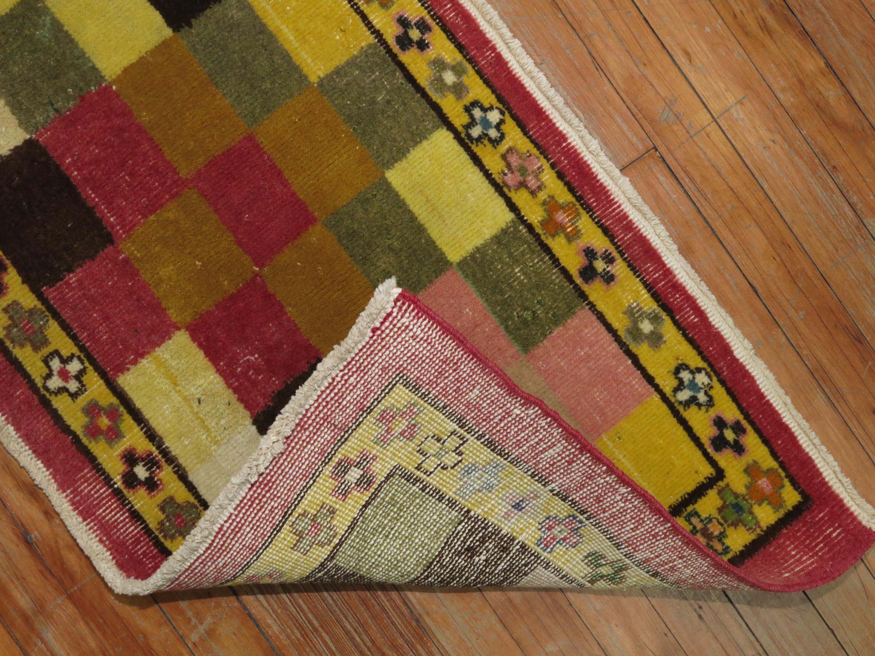Funky narrow vintage Turkish runner, dated 1972. Pinks, yellow, brown, goldenrod, pea green accents

Measures: 1'9'' x 7'.