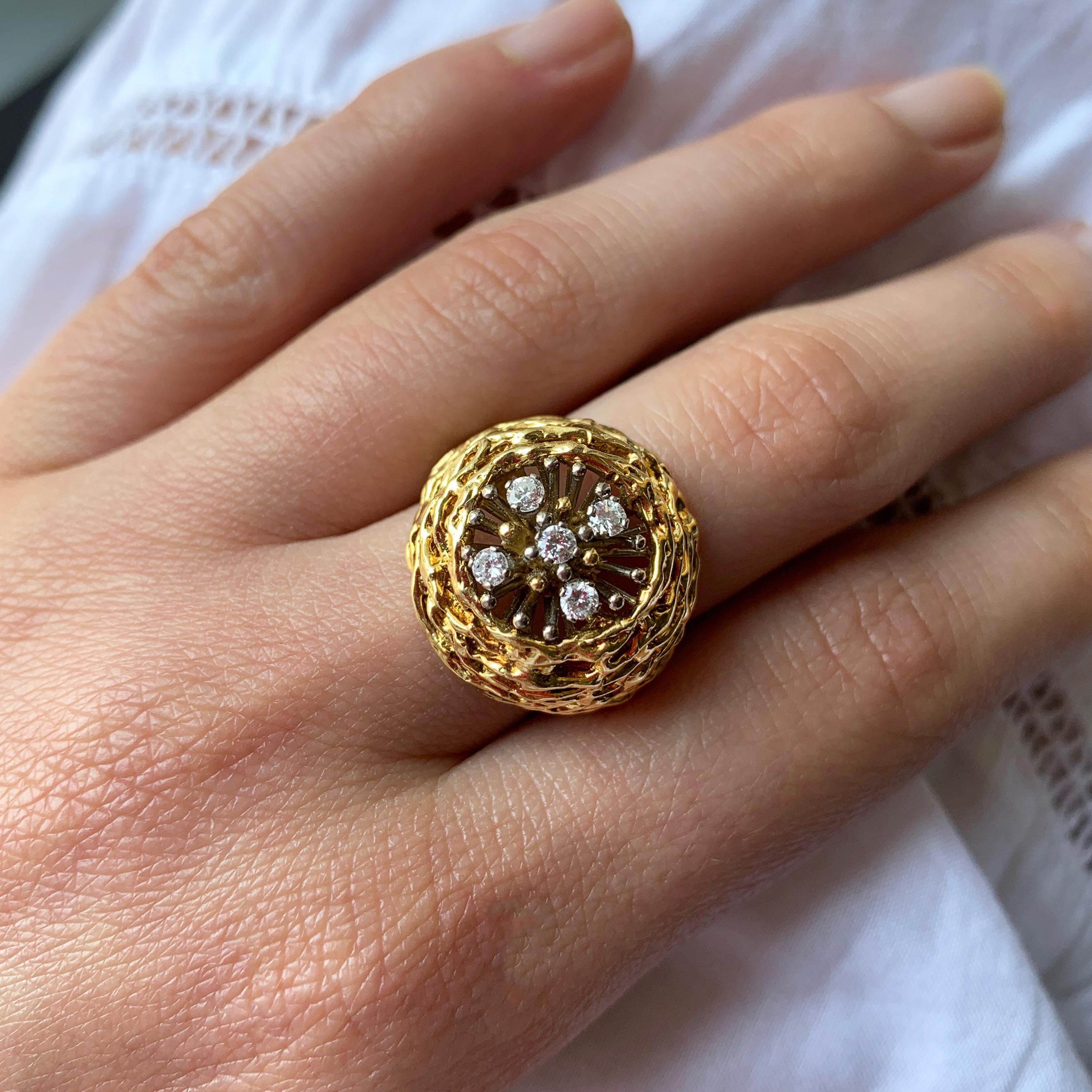 A diamond and 18 karat gold ring, by David Thomas, 1972. Atlantis collection, limited edition for Prestige Jewellers.

Signed David Thomas and numbered 25. Stamped with London hallmarks. Total diamond weight approximately 0.15-0.2 carats.

Ring size